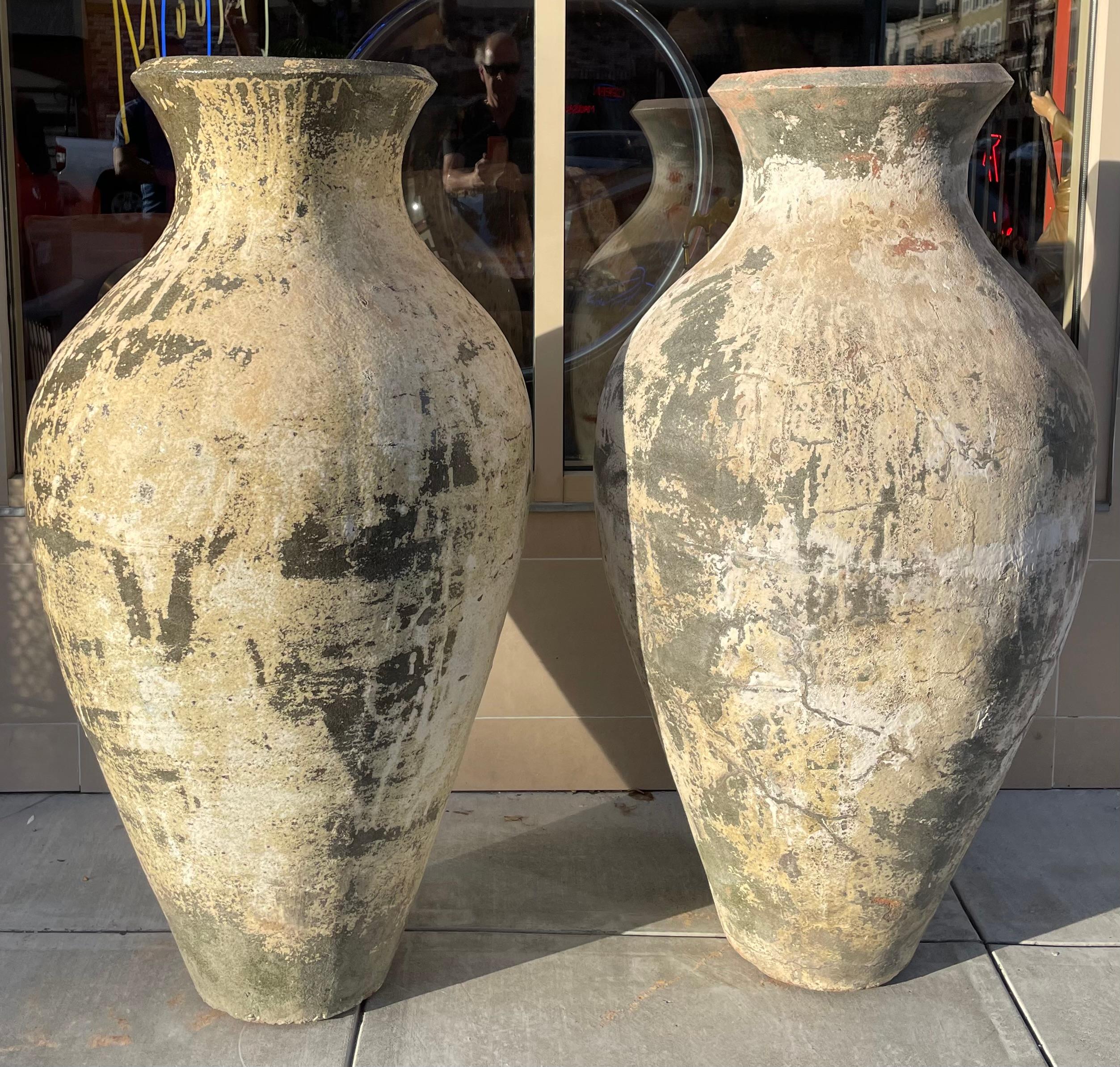 The commanding scale of these extra large Thai vessels makes them ideal statement pieces for either indoor or outdoor use. The pots are contemporary and are cast in iconic old world shapes, and then through a series of chemical applications, they