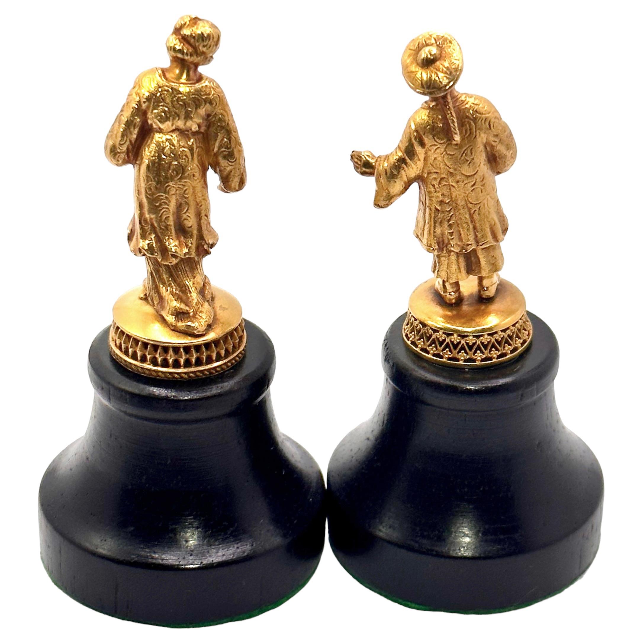 This extremely well executed pair of Antique Asian Caricatures in traditional garb are unique in our experience. It is evident from the manner and dress of these small jewels, that this pair are from a noble social class. Each figure is
