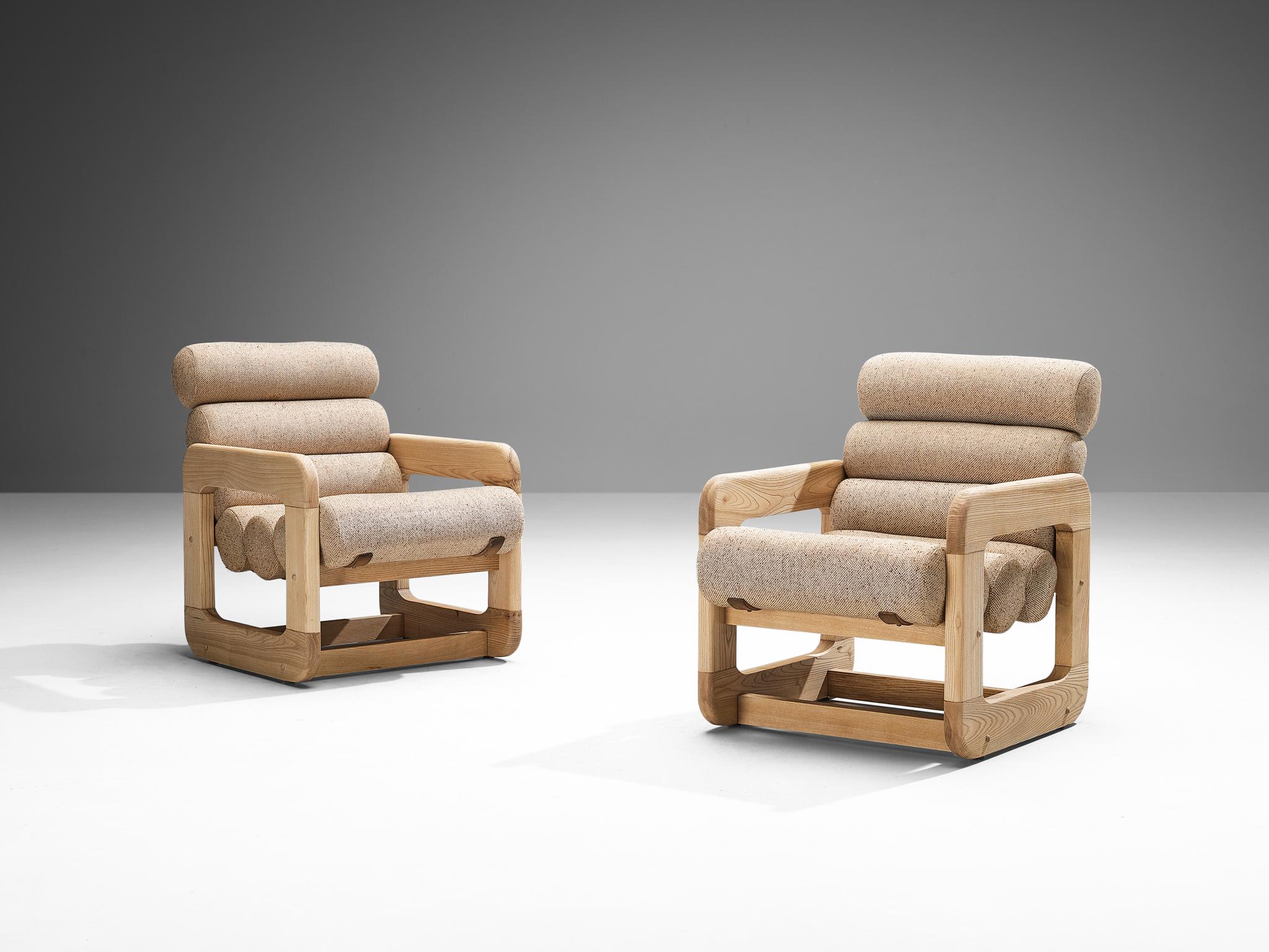 Pair of lounge chairs, ash, fabric, Europe, 1970s. 

Pair of two unconvential lounge chairs that feature an outstanding design. The seating contains multiple tube-shaped cushions attached together to create a seat and backrest. The repetition of the