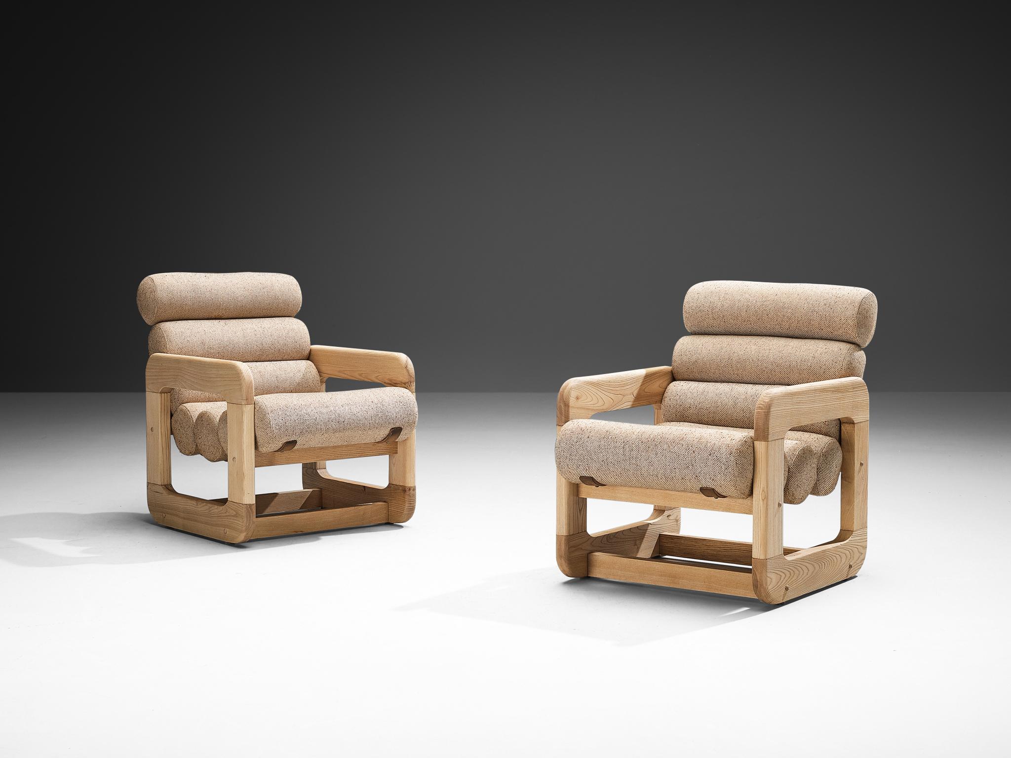 Pair of lounge chairs, ash, fabric, Europe, 1970s. 

Pair of two unconventional lounge chairs that feature an outstanding design. The seating contains multiple tube-shaped cushions attached together to create a seat and backrest. The repetition of