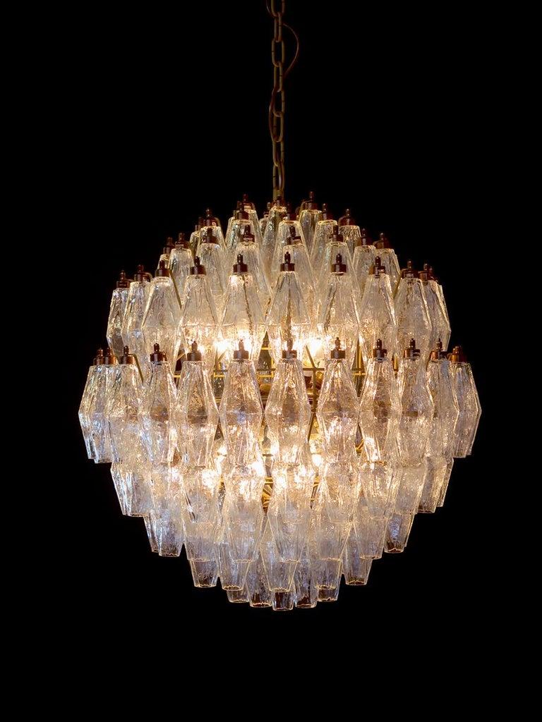 Each composed by 140 polyhedral-shaped glass pendant, ice and 'Acquamarina' color.
The color of central frieze is customizable on request. 
Measures: Height without chain is 75 cm with chain is cm 130
Diameter cm 60.