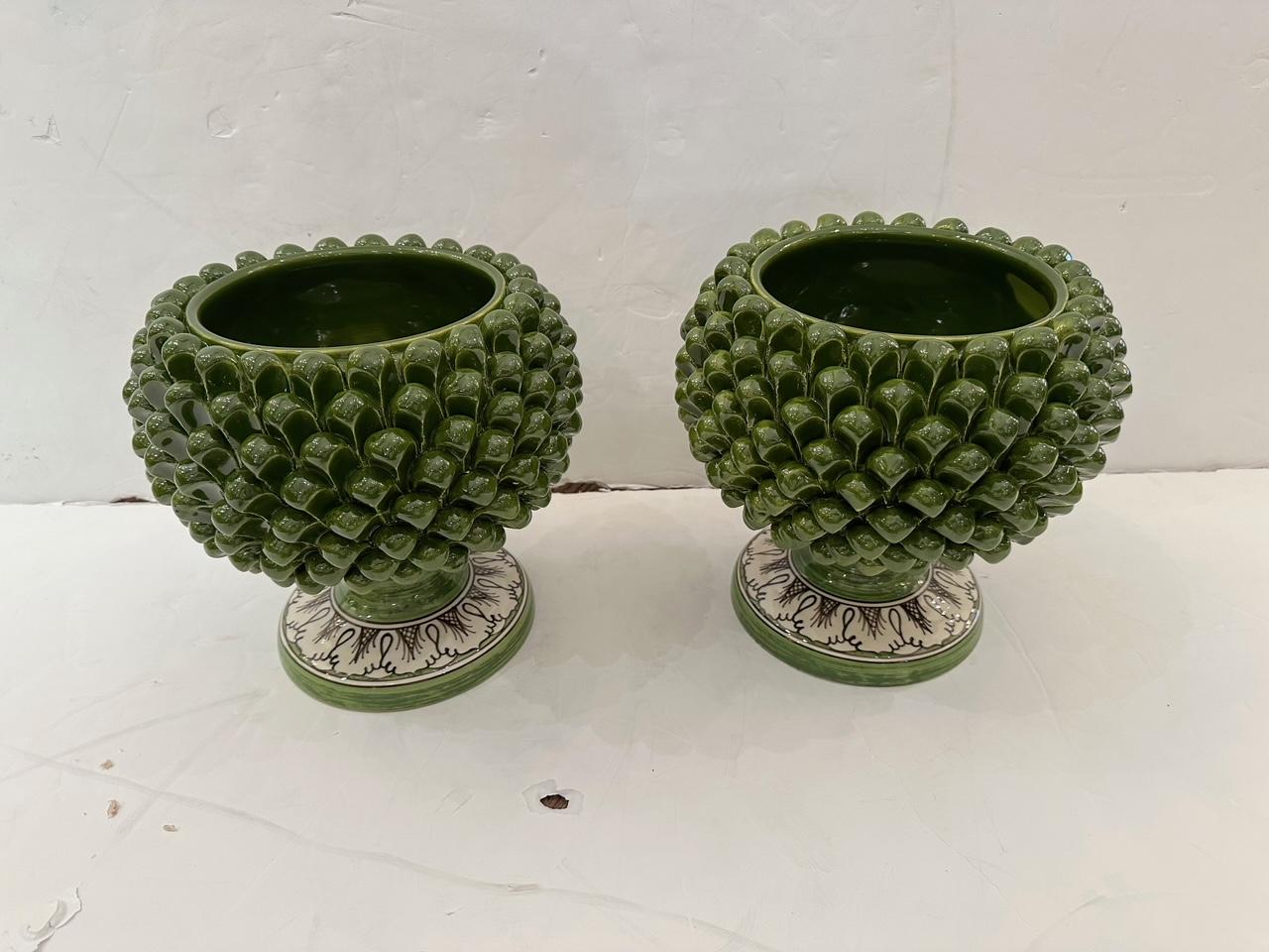 Pair of Italian-made traditional vases inspired by pinecone pattern by Abhika 

Opening 6.25 diameter

