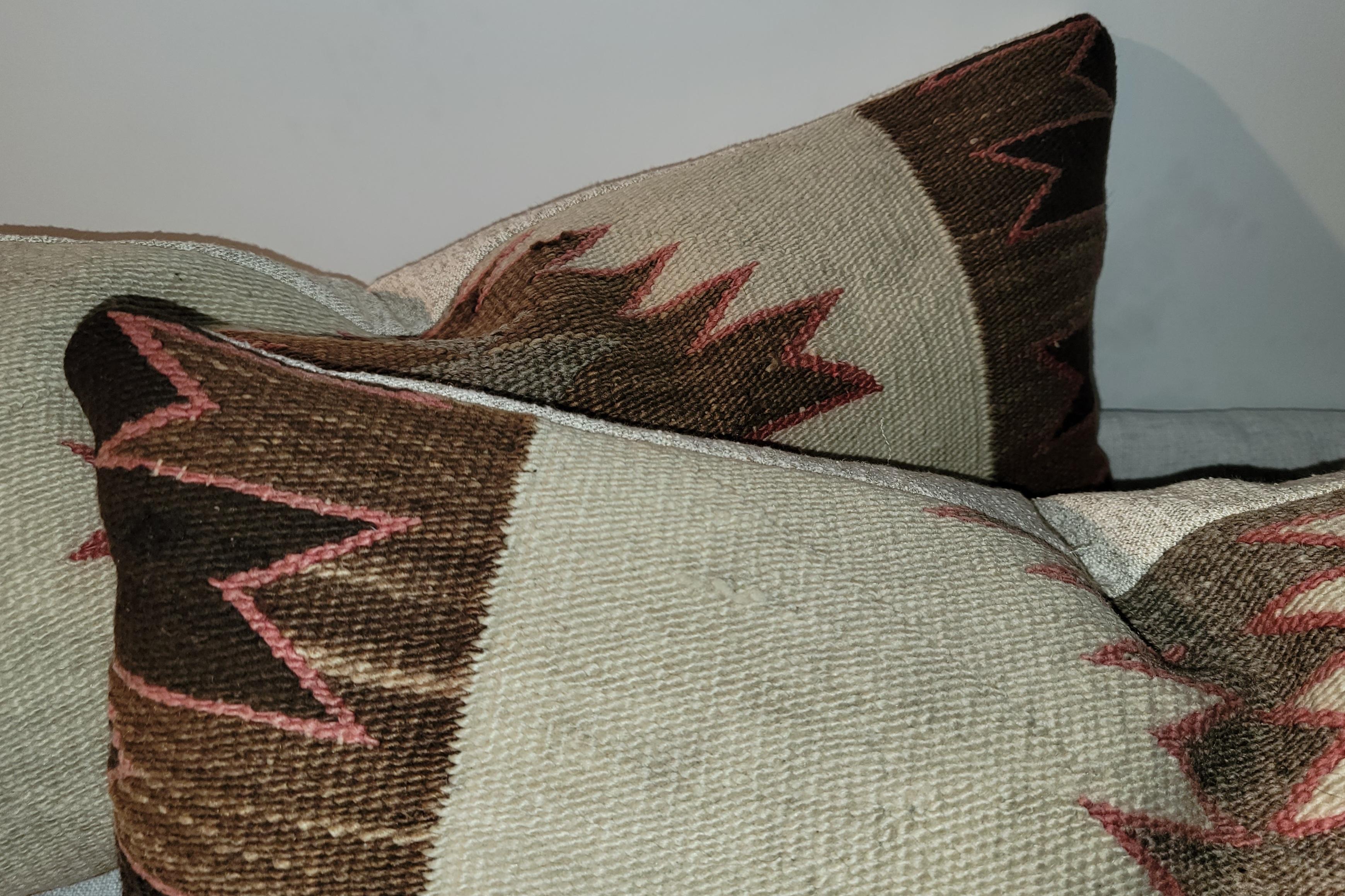 Pair of Beautifil Eye Dazzler Navajo Indian Bolster Pillows. Feather and Down inserts and zippered casing.
Pillow measures 30 x 15 
Smaller pillow measures 30 x 14.