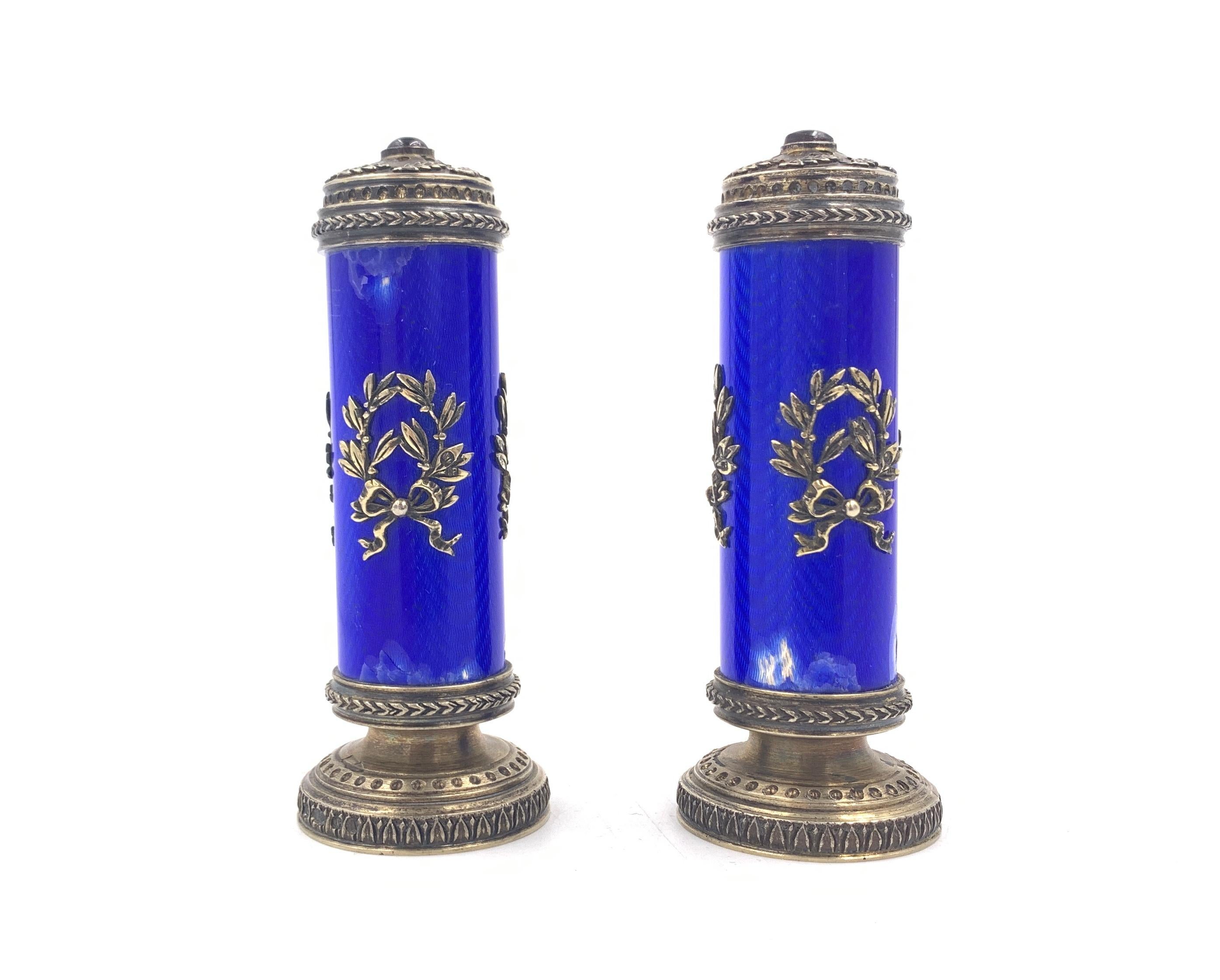 Pair of Russian silver and enamelled peppers inset with cabochon rubies to tops contained within a fitted box marked 'Fabergé'.
 