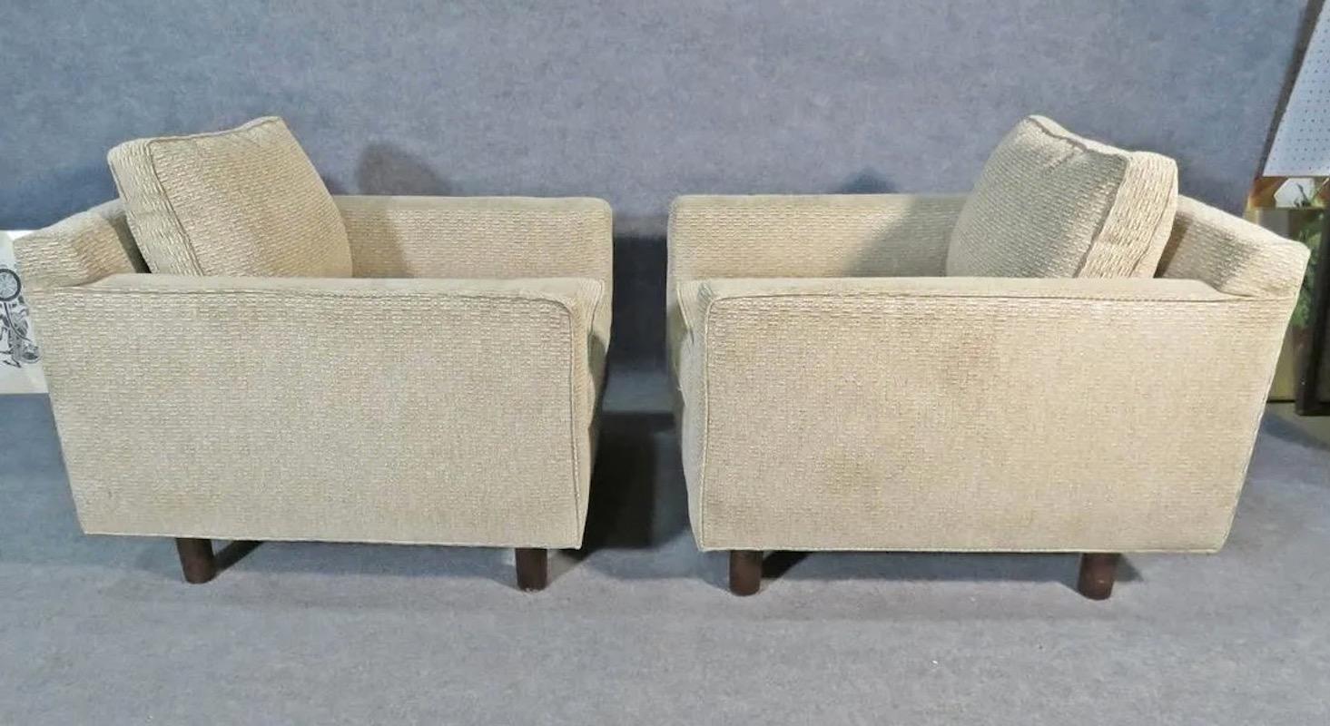 With an extremely comfortable yet minimal design, this pair of upholstered club chairs by Mitchell Gold + Bob Williams feature quality materials and Made in USA craftsmanship. Perfect for any home, office, or lounge setting. Please confirm item