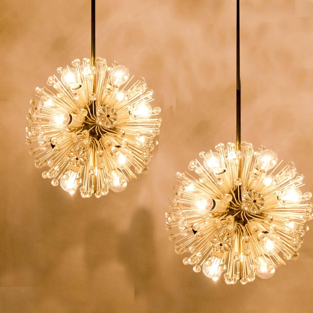 Sputnik nine-light brass fixture with copious amounts of Austrian crystals by Emil Stejnar for Nikoll. Cosmological. This glamorous delicate brass ‘Snowball’ Sputnik chandelier is also known as ‘pusteblume’ or ‘snowflake’ and is made in Vienna,