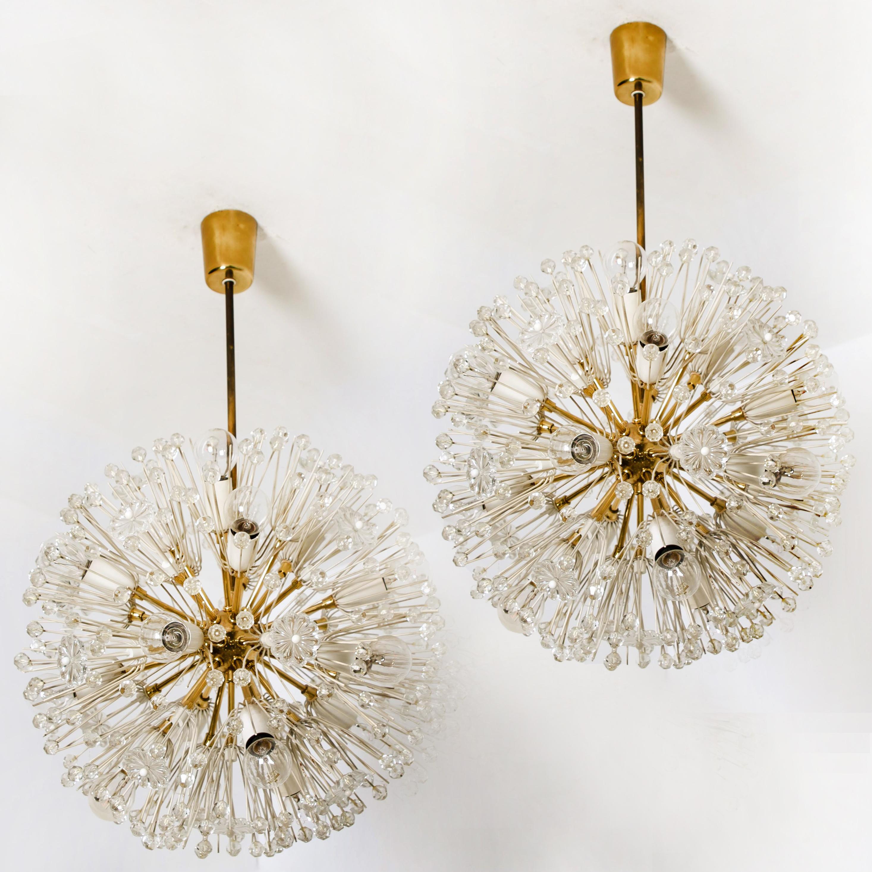 A pair of seventeen-light brass Sputnik fixtures with copious amounts of Austrian crystals by Emil Stejnar for Nikoll. Cosmological. Measures: Ø 17