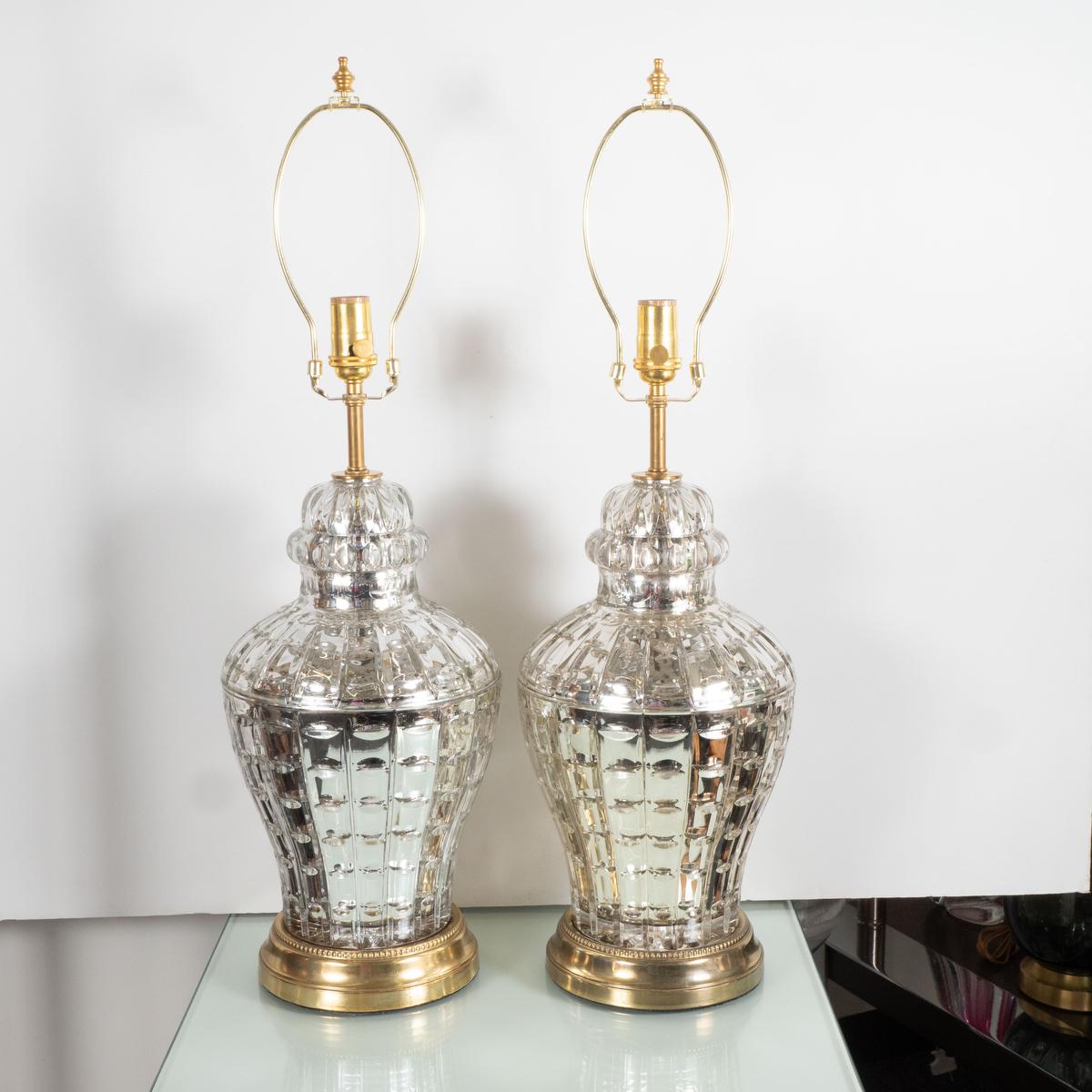 Pair of urn shaped, etched and faceted mercury glass lamps.