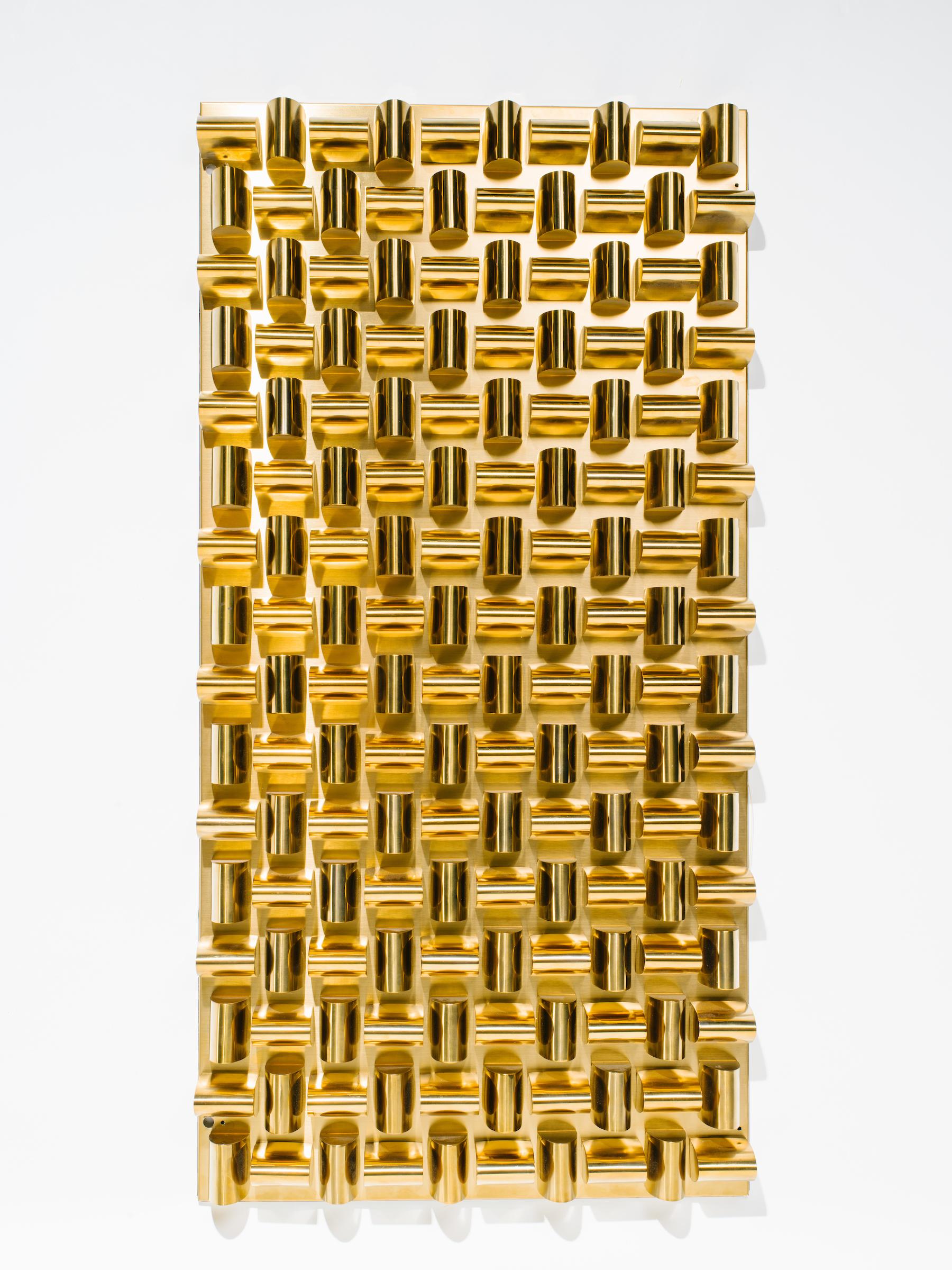 Stunning pair of modernist wall sculptures in brass metal with faceted design. Wall panels consists of raised rounded triangles alternating vertically and horizontally, creating a woven pattern. The panels can be hung vertically or landscape. Fitted