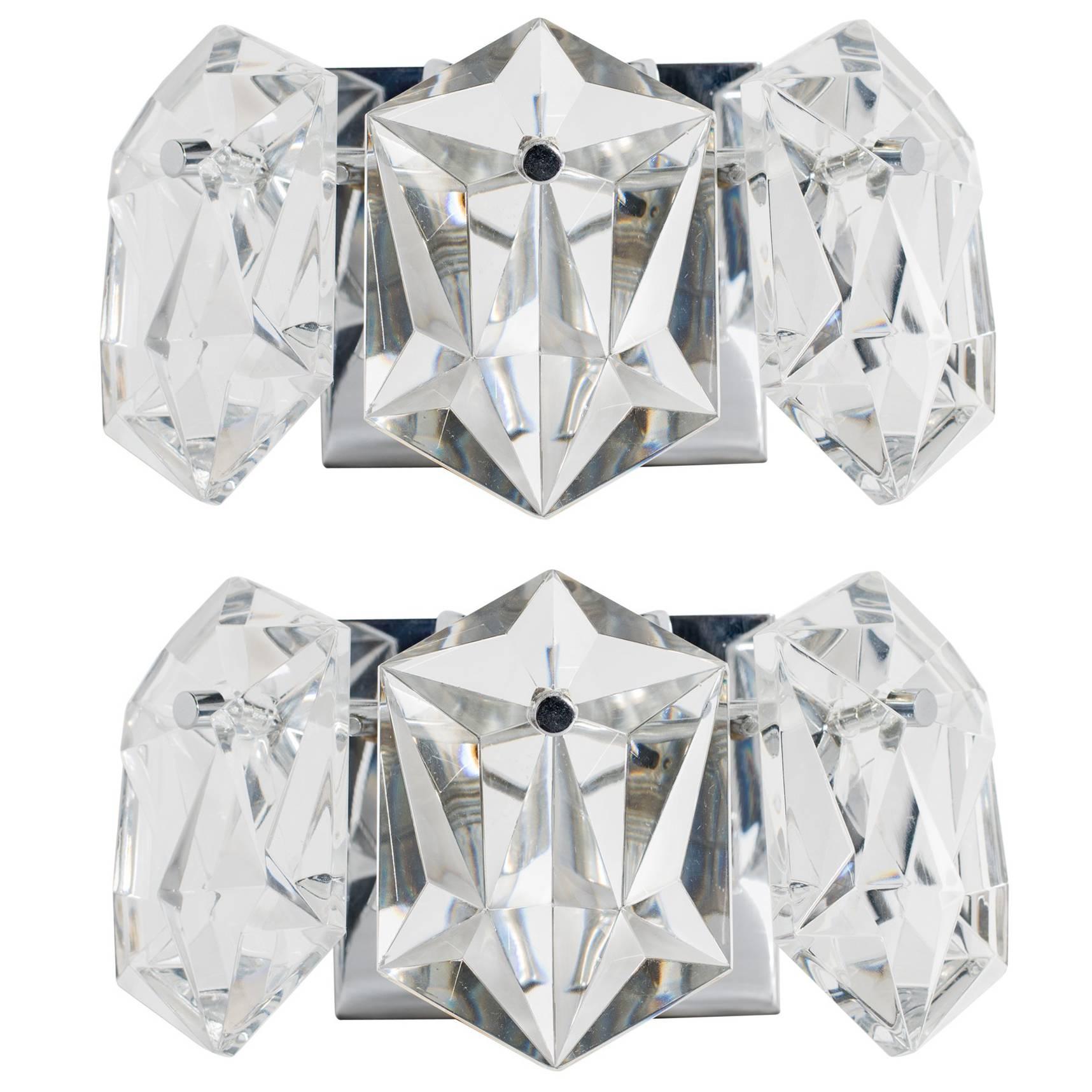Exquisite pair of petite Mid-Century Modern sconces, fitted with three faceted crystal prisms. Simple floating frames are finished in polished nickel with matching fittings. Newly rewired and fitted with two lights each. Perfect scale for powder