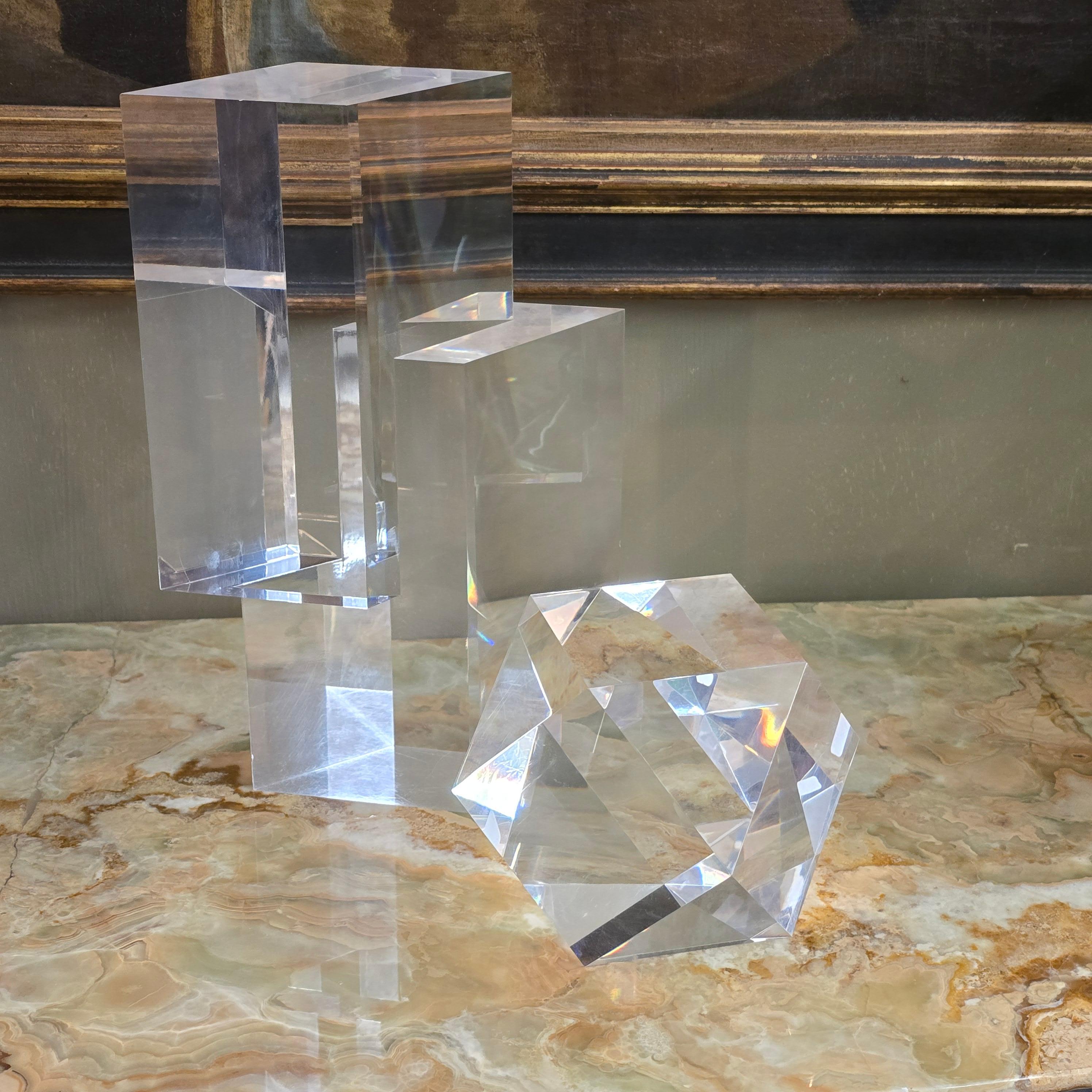 Stunning pair of faceted optical lucite sculptures by the famous Italian designer/artist Alessio Tasca circa 1970.  Both sculptures are individually signed.  Size in measurements is for large one.  

Alessio Tasca was a known Italian artist, born in