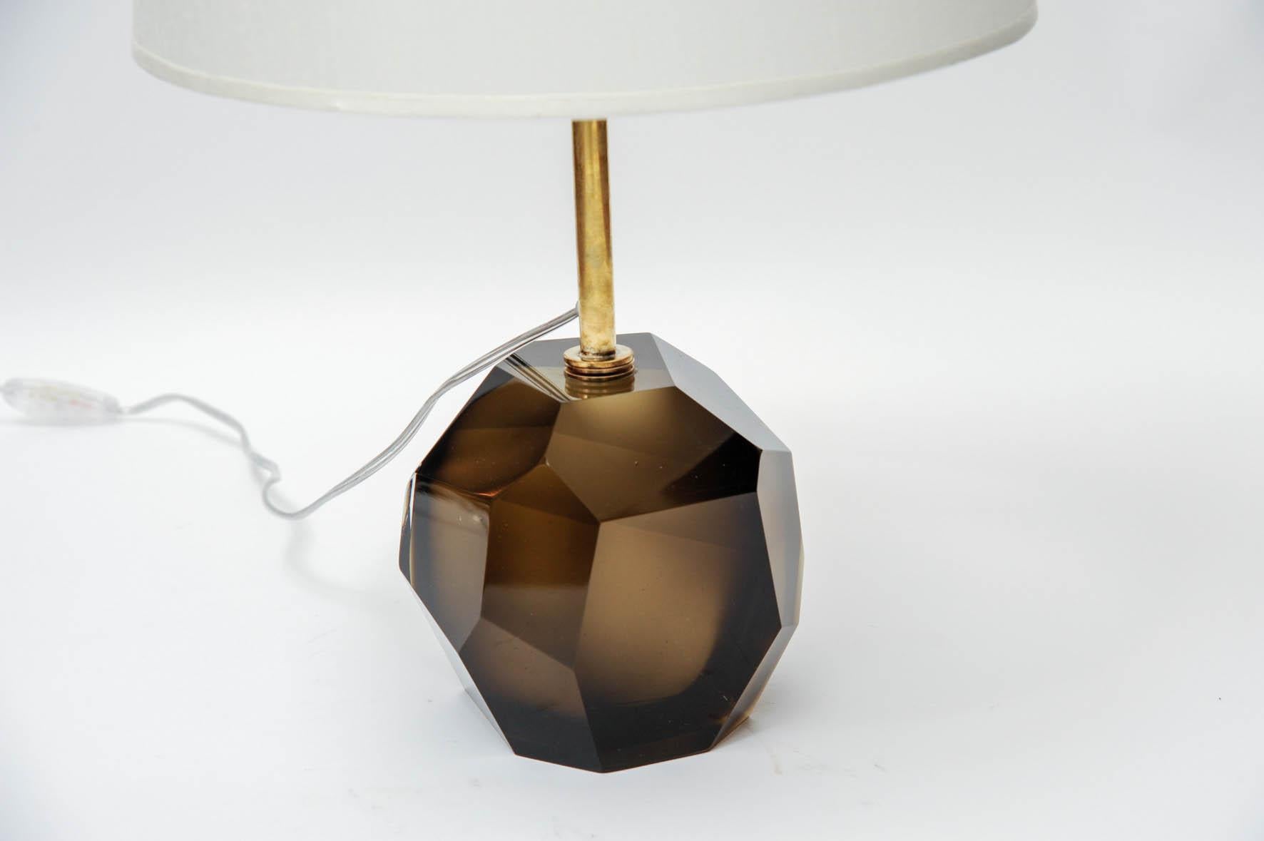 Pair of table lamps made of faceted glass blocs in this chic smoked color with a long brass neck.