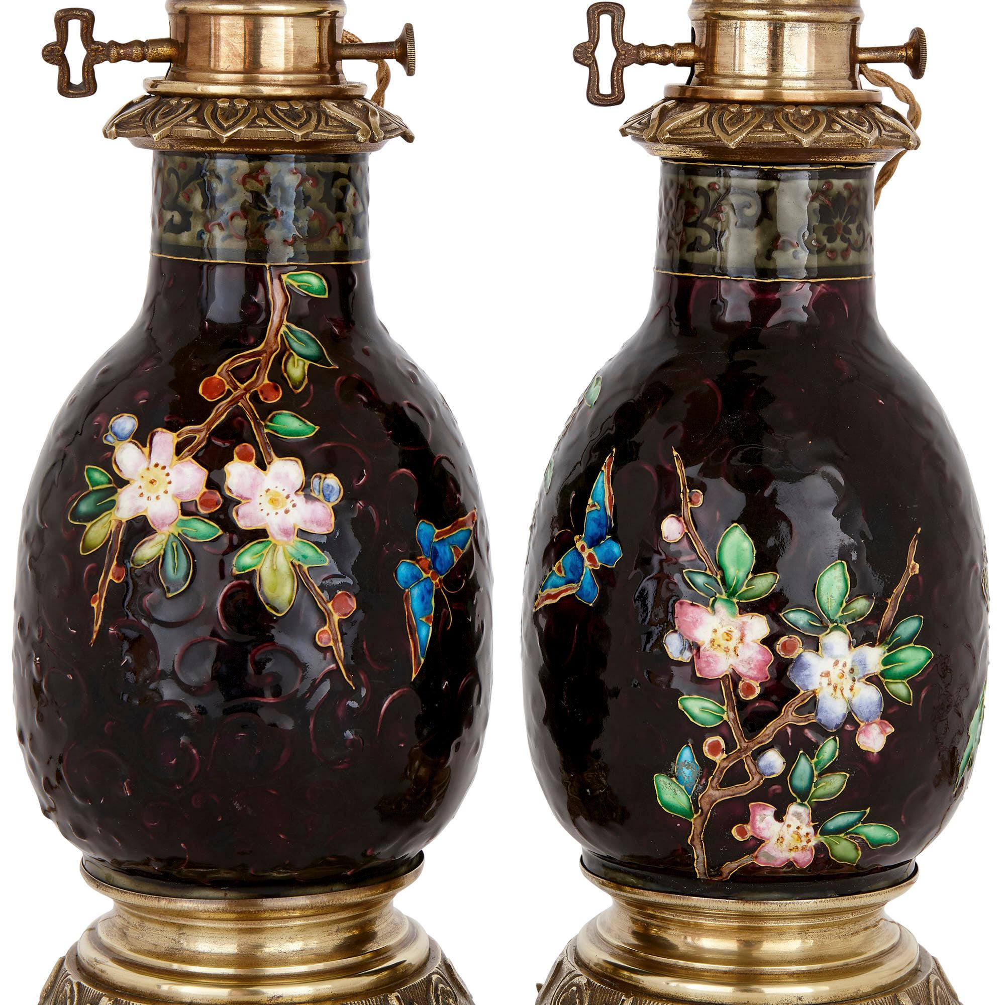 These wonderful oil lamps have been attributed to the prestigious ceramic company, Viellard & Cie. The firm was established in 1845 in Bordeaux, France. It was directed by Jules Vielliard in partnership with his two sons, Albert and Charles. These