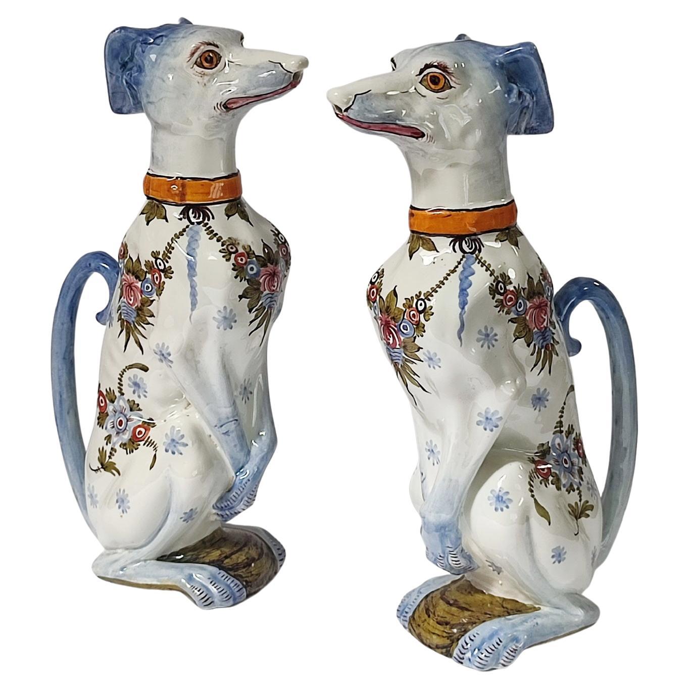 Superb and rare pair of pitchers in barbotine of Saint-Clement, shaped as sitting dogs (greyhounds), in perfect condition.
Large polychrome flowers and blue worsted coat on them and on handles.
One of the GYPP dog family pitchers, each pitcher is