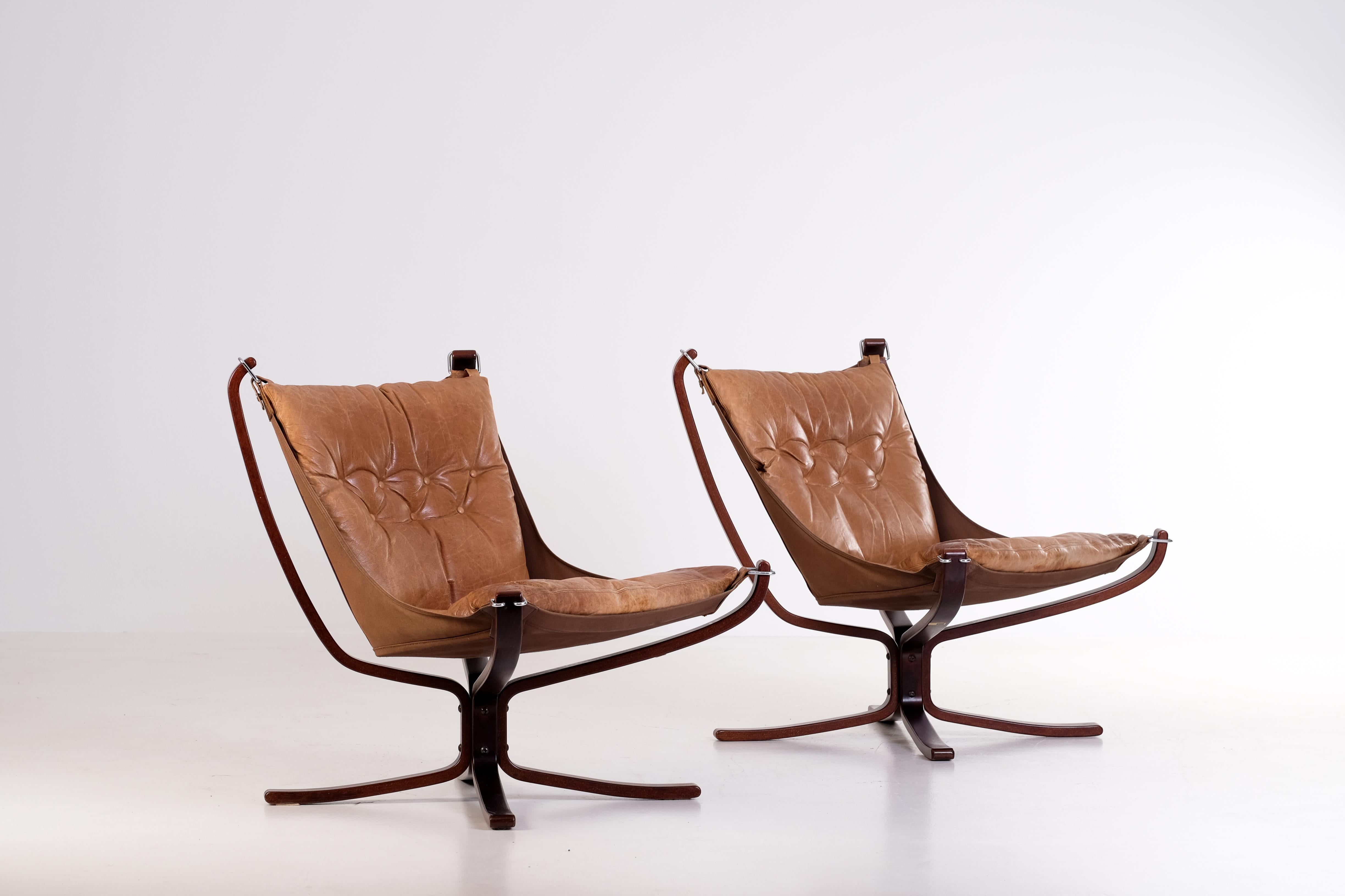 Norwegian Falcon chairs in brown leather by Sigurd Ressel, Norway, 1970s. 
Good vintage condition with signs of usage and patina.
Please note: flat-packed global shipping available: €1000.

