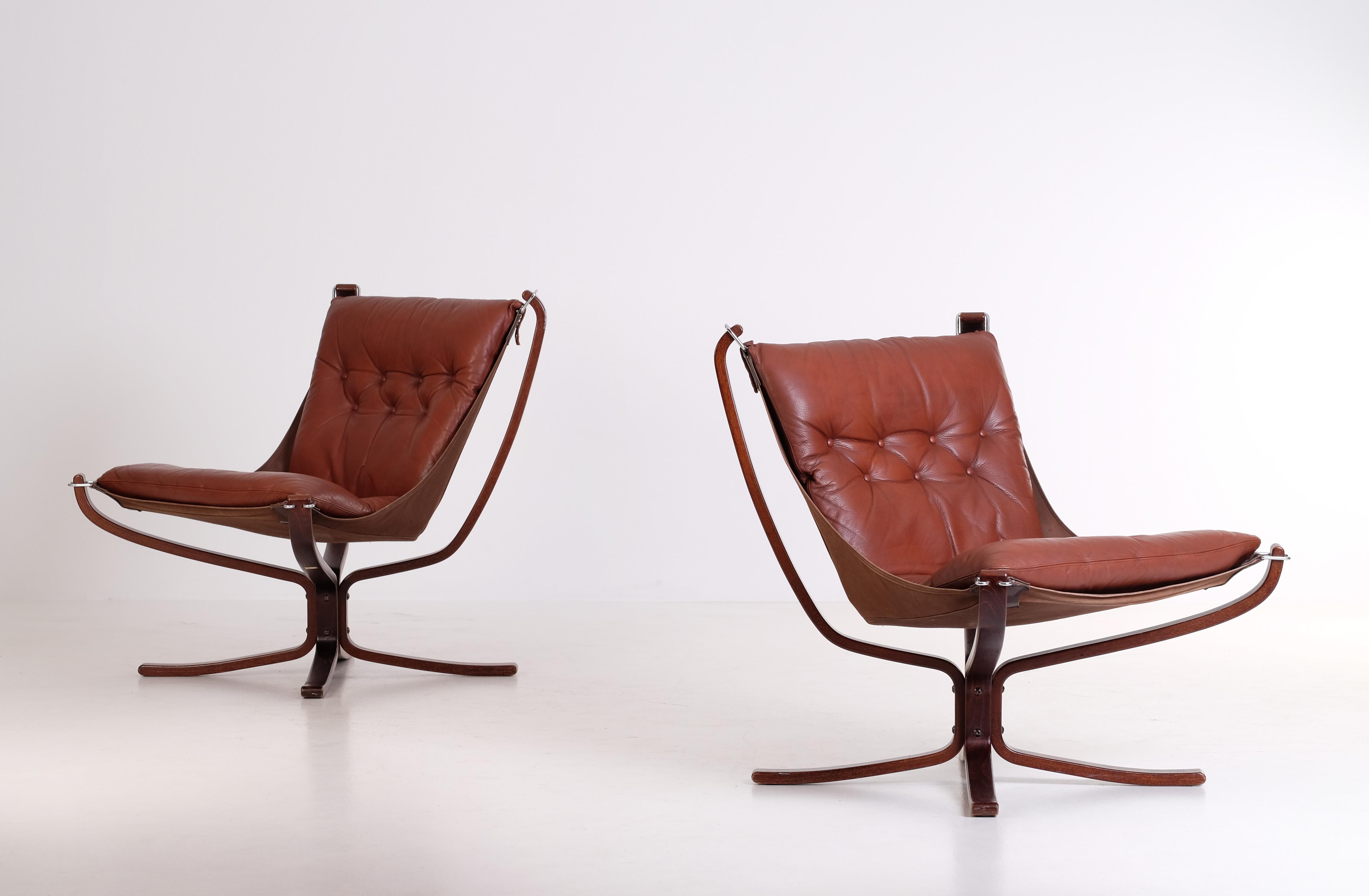 Norwegian Falcon chairs in brown leather by Sigurd Ressel, Norway, 1970s. 
Good vintage condition with signs of usage and patina.
Please note: flat-packed global shipping available: €1000.