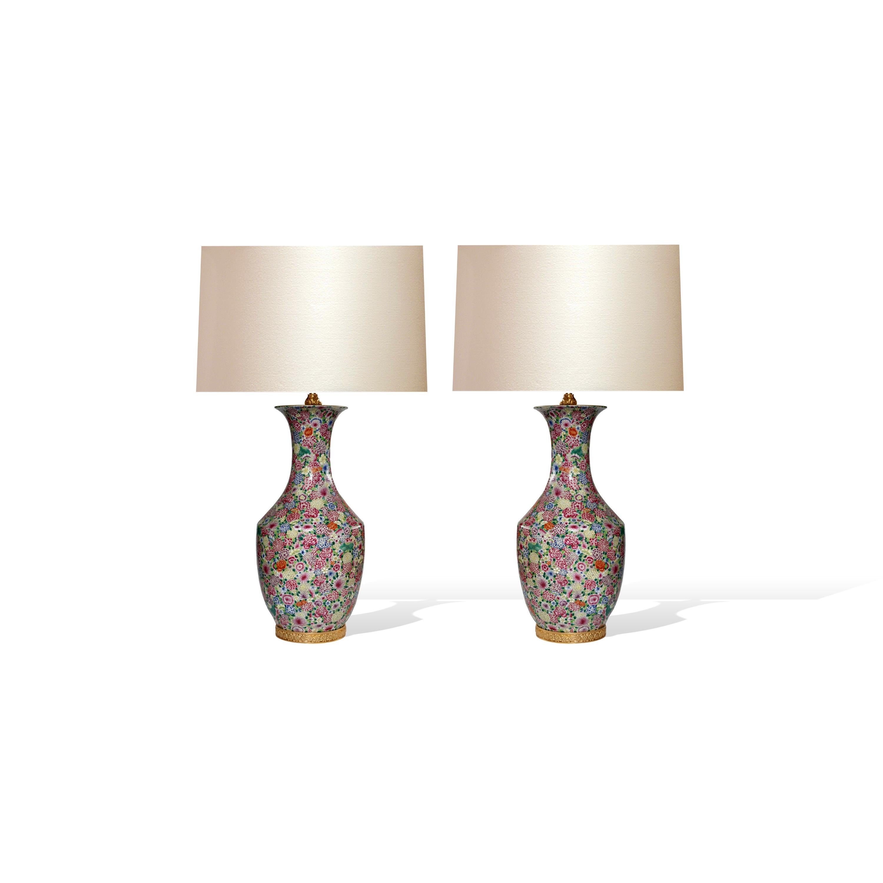 Pair of finely painted famille rose porcelain lamps with flower blossom decoration. 
To the top of the lamp body: 23”/H. 
(Lampshades not included).