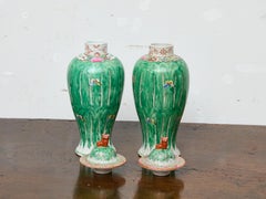 Pair of Famille Verte Lidded Vases with Butterflies and Lion Finials, circa 1920