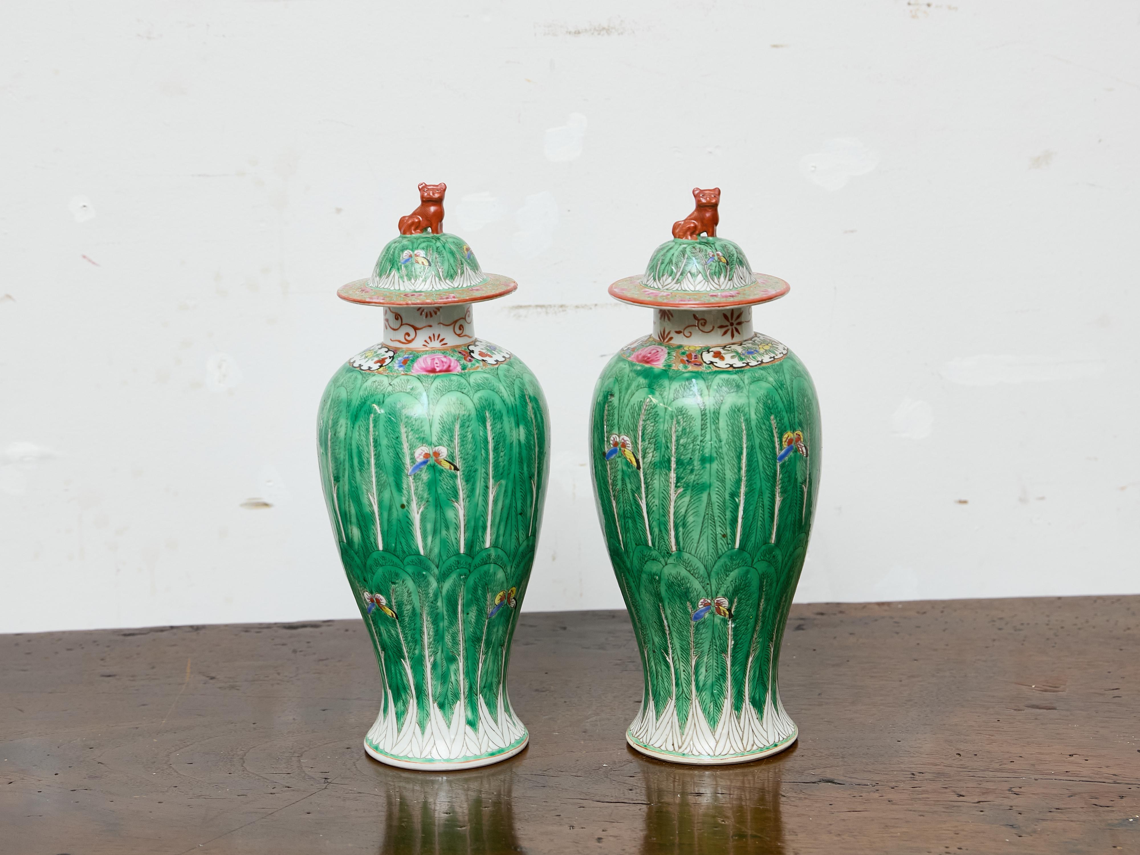 Pair of Famille Verte Lidded Vases with Butterflies and Lion Finials, circa 1920 In Good Condition For Sale In Atlanta, GA