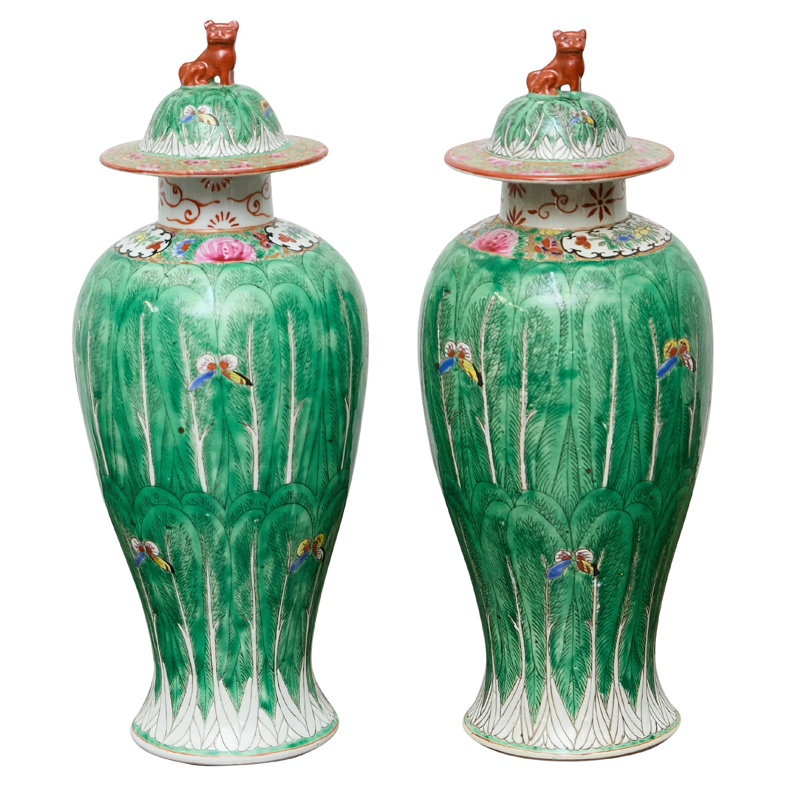 Pair of Famille Verte Lidded Vases with Butterflies and Lion Finials, circa 1920 For Sale