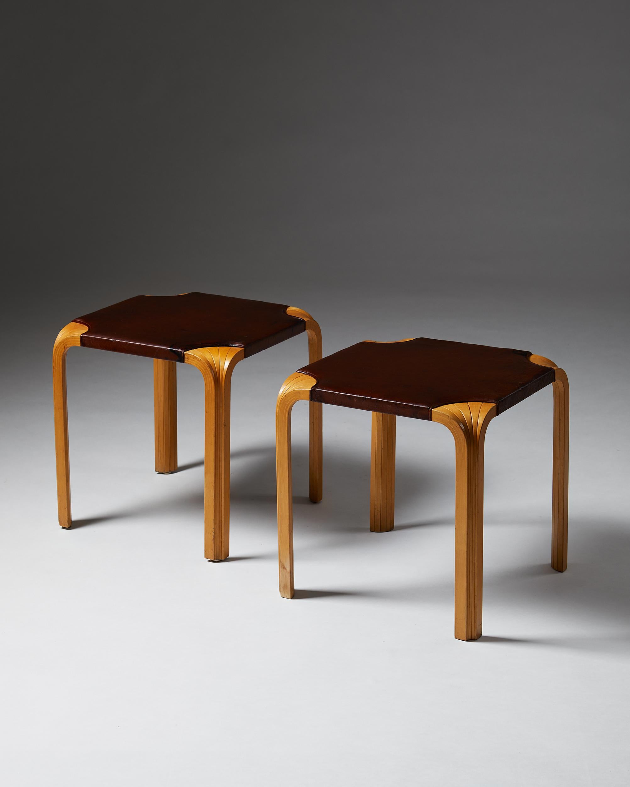 Pair of fan-leg stools, model S601, designed by Alvar Aalto for Artek,
Finland, 1954.
Birch and original leather.

Measures: L 45 cm/ 17 3/4