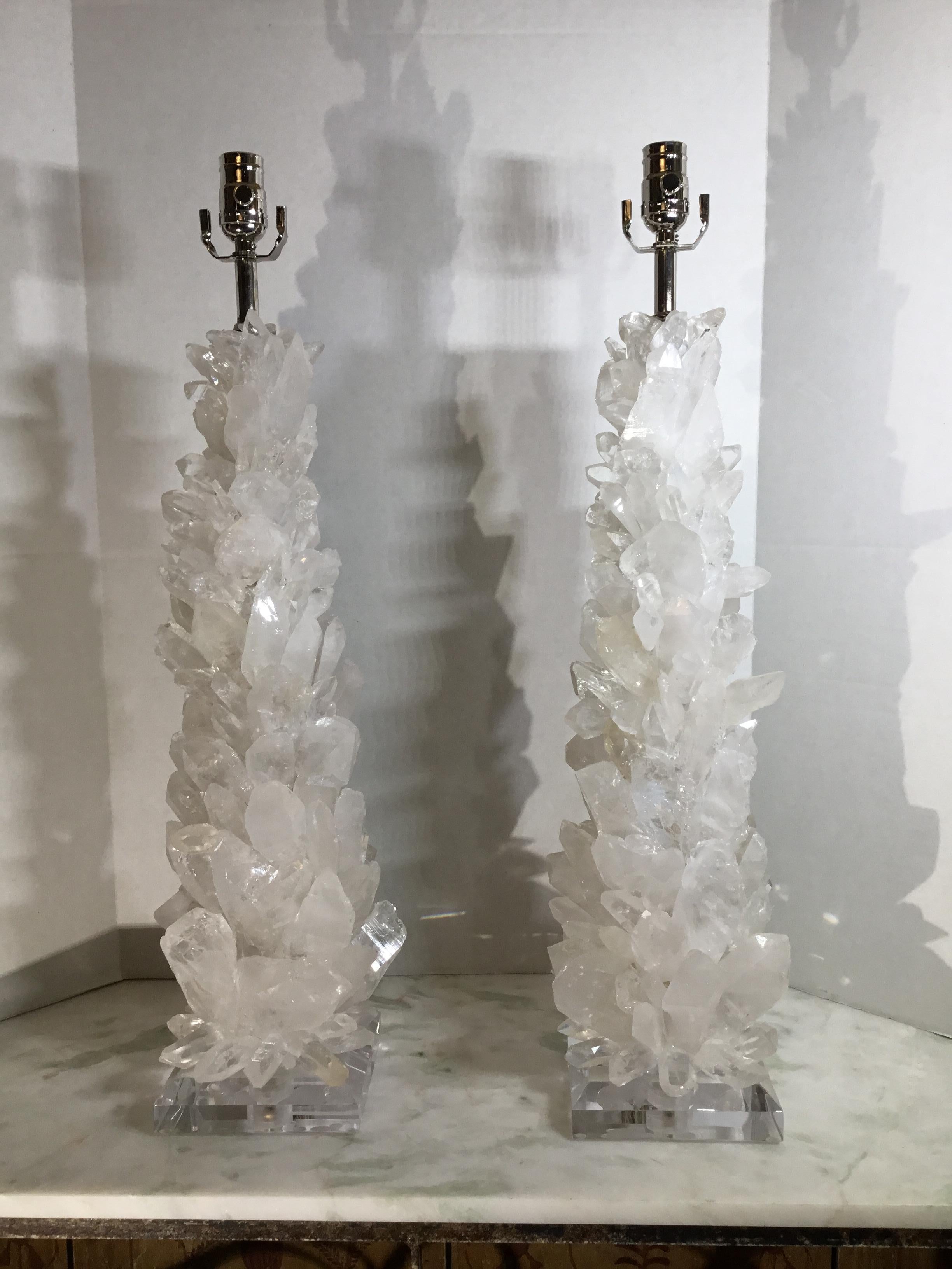 Beautiful pair of table lamps made of genuine white crystal quartz shards and clear point crystal quartz, artistically put together to make on of a kind impressive pair of table lamps for display .
Clear beveled Lucite base, size: 6” x 6” x