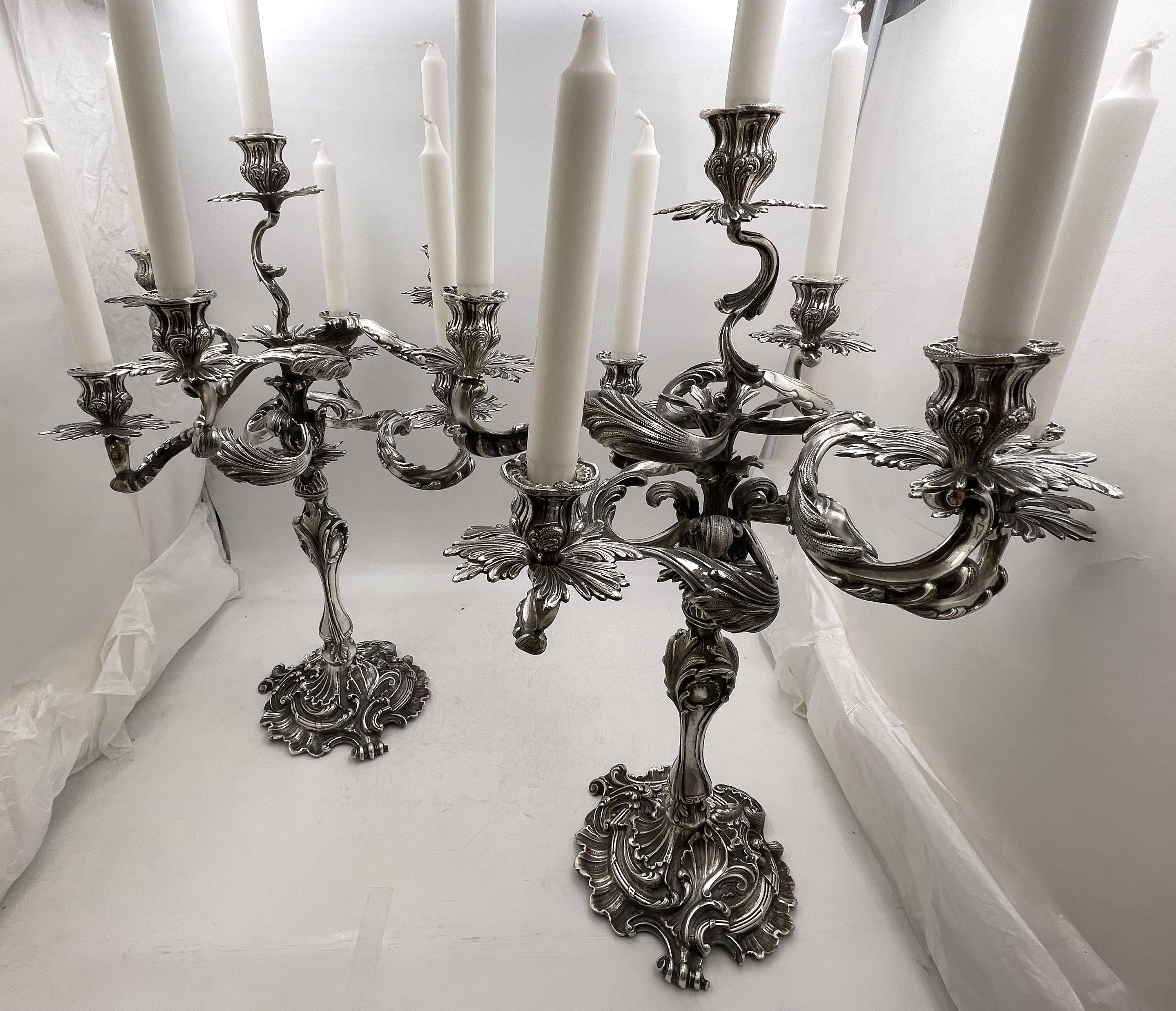 Pair of Fasoli, Italian continental silver 7-light candelabra, from the late 19th or early 20th century, beautifully adorned with stylized natural motifs, the arms spreading in a curvilinear design. They measure 22 1/2'' in height by 16 1/2'' from