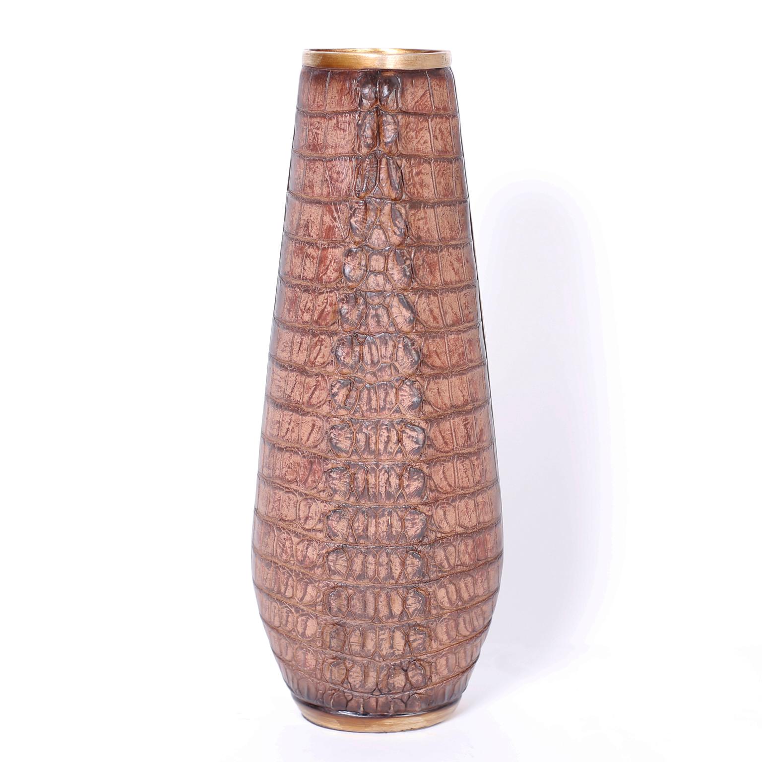 Pair of tall vases ingeniously crafted in cast composition depicting alligator hide with brass like highlights.