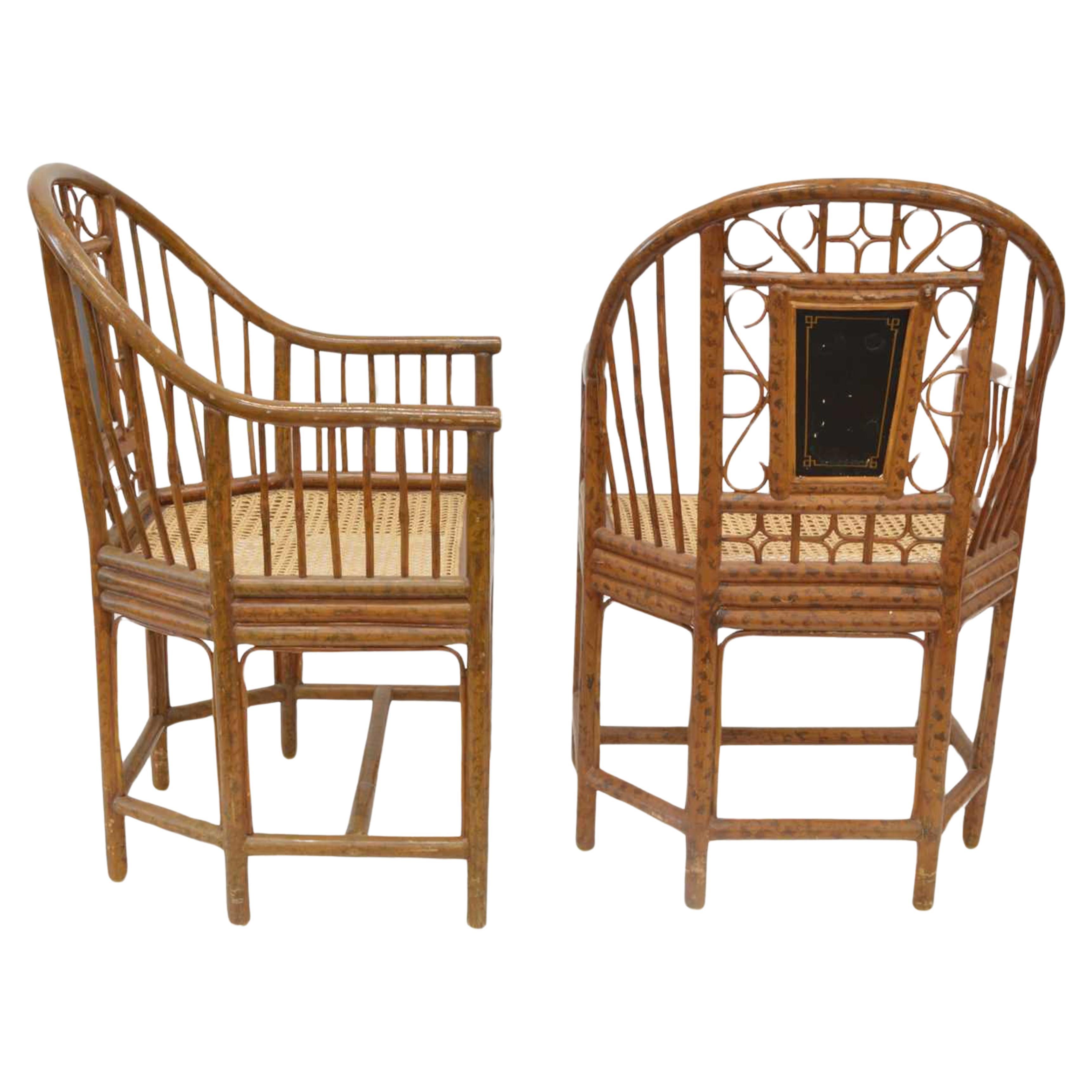 A Handmade Pair of Brighton Pavilion Chairs With Caned Seats & Painted Faux Burnt Bamboo Finished Frame.

Each seat rears features Chinoiserie figures painted gilt panels.
Painted panel over a shaped caned seat, raised on six legs united by