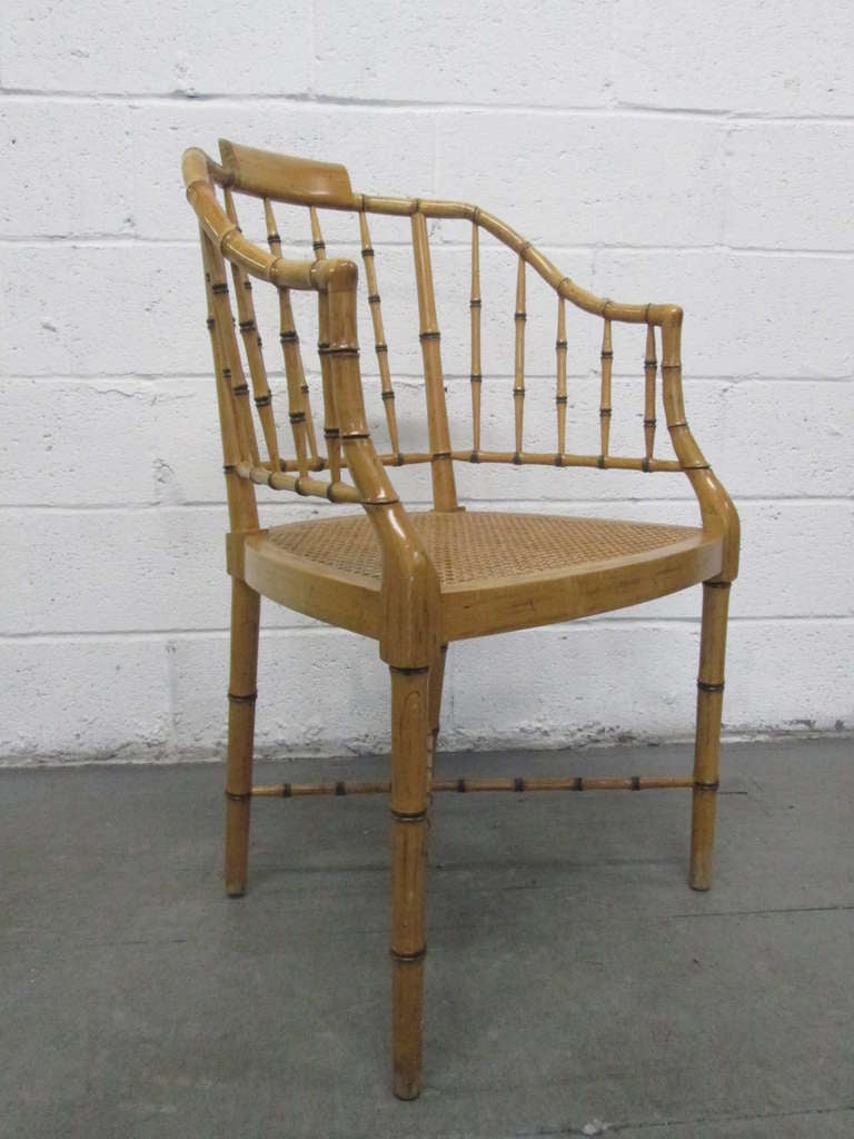 Pair of faux bamboo baker chairs with caned seats. Baker.
 