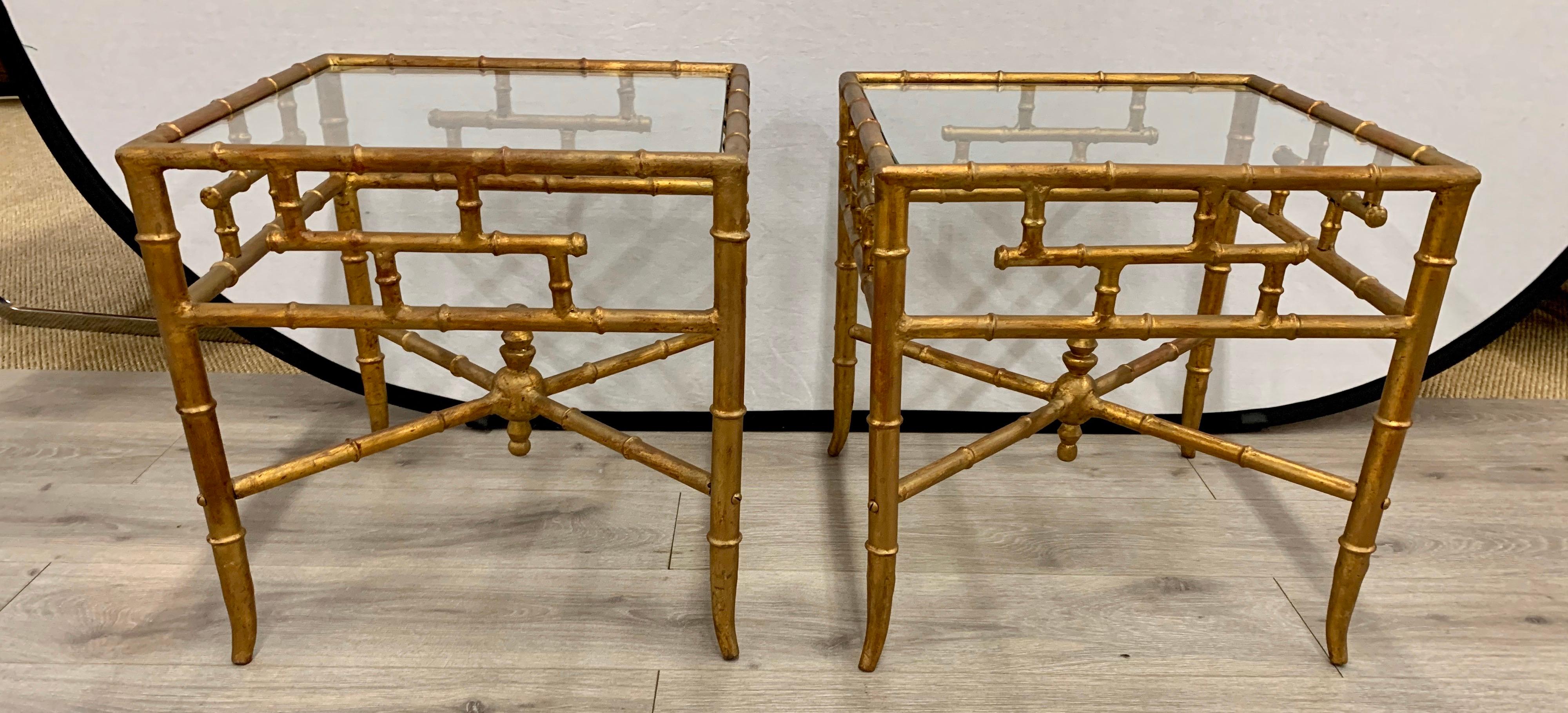 Pair of vintage faux bamboo Chinese Chippendale gilt side tables. Features glass tops and gilt all around.
Perfect in bedroom, study or living room.