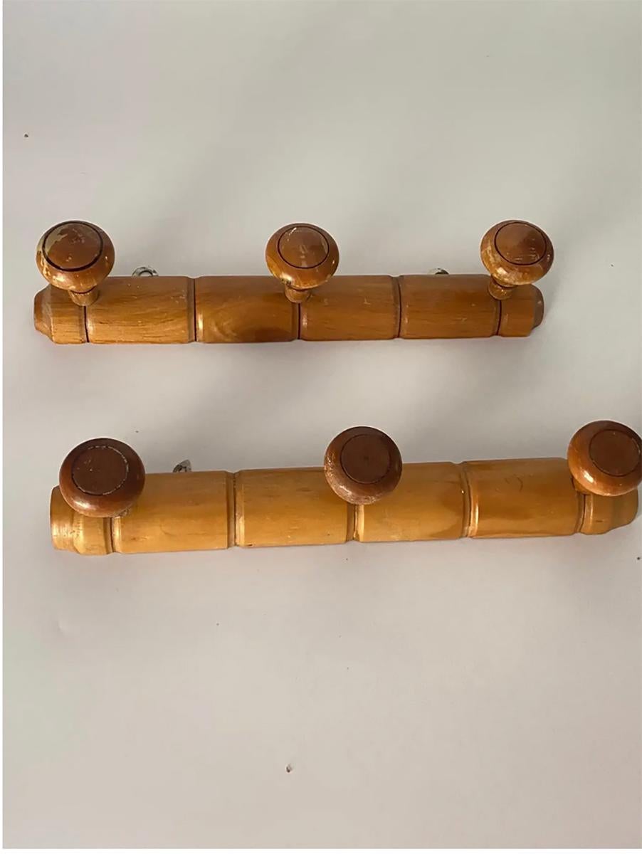 An early 20th century French maple pair of coat or hat rack, carved to mimic bamboo. Perfect for having hats, coats, belts, and scarves, or brooms and dustpans in our utility closet.
  
