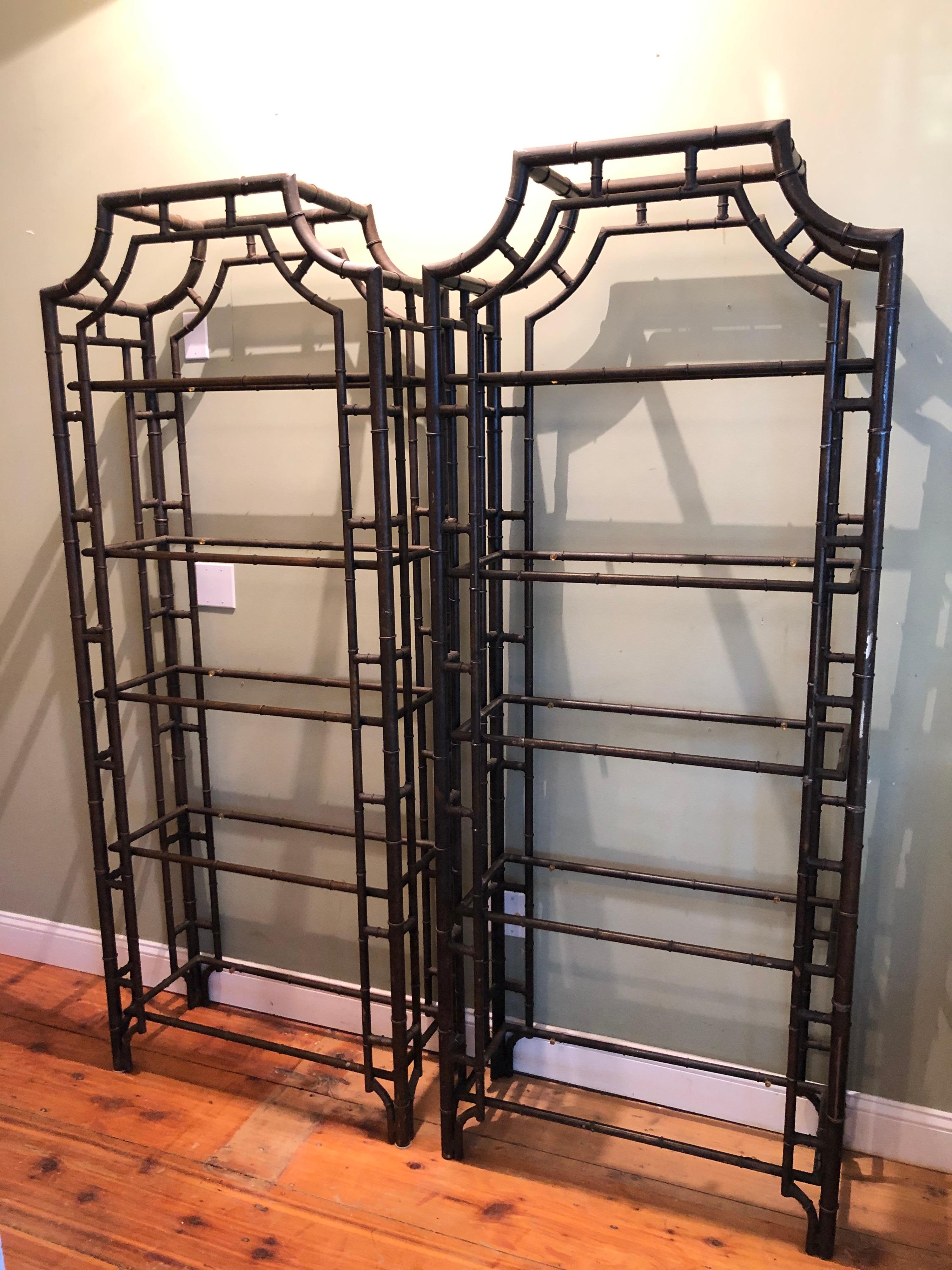 Pair of faux bamboo Pagoda étagères. Extremely well made heavy iron étagères. Comes with five glass shelves on each étagère. Has a dark brown oiled looking finish with tiny black spots. We have the glass but did not place in photos. Please request