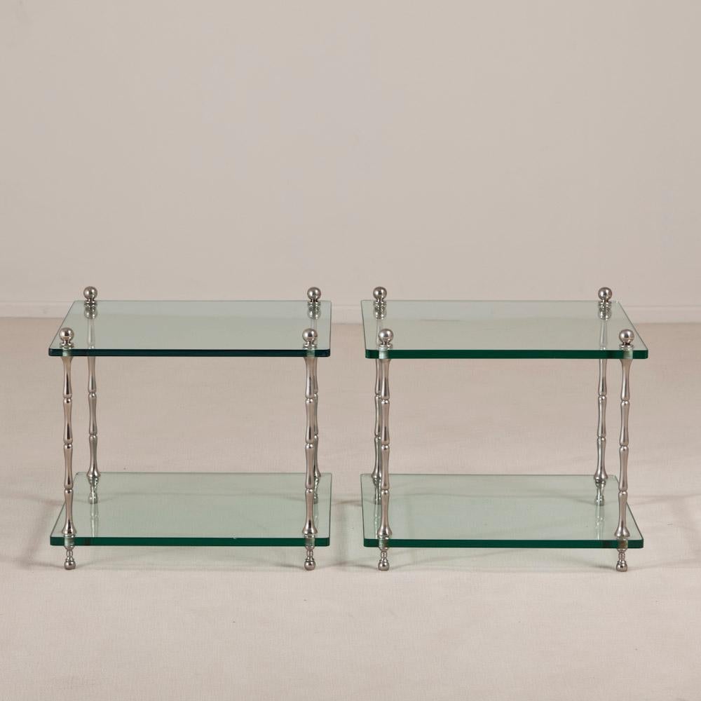 A pair of nickel framed side tables simulating bamboo with two tiers of glass, 1970s