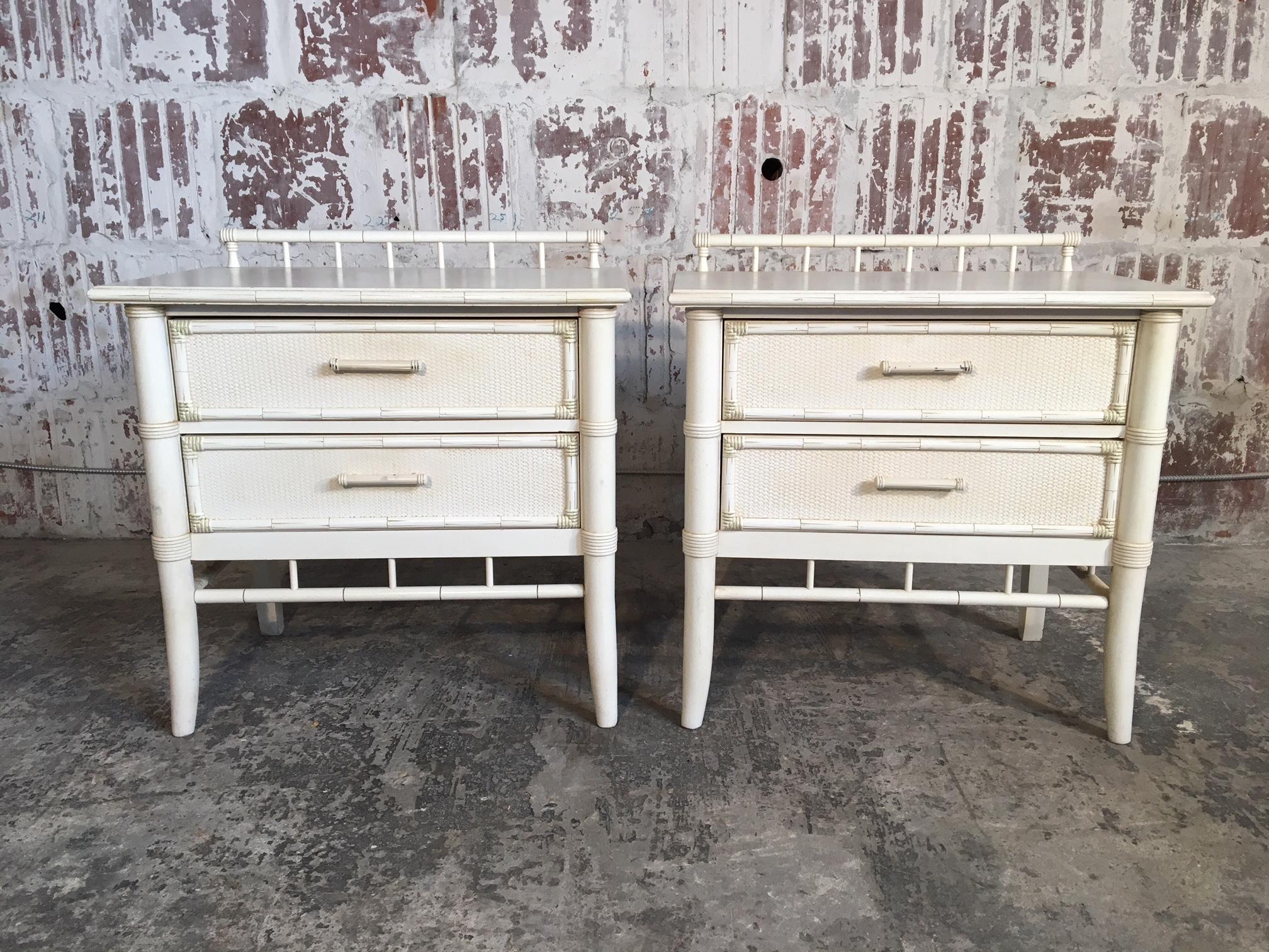 Pair of Thomasville faux bamboo nightstands in original white finish. Decorative gate detail along top, circa 1976. Excellent vintage condition with very minor signs of age appropriate wear.