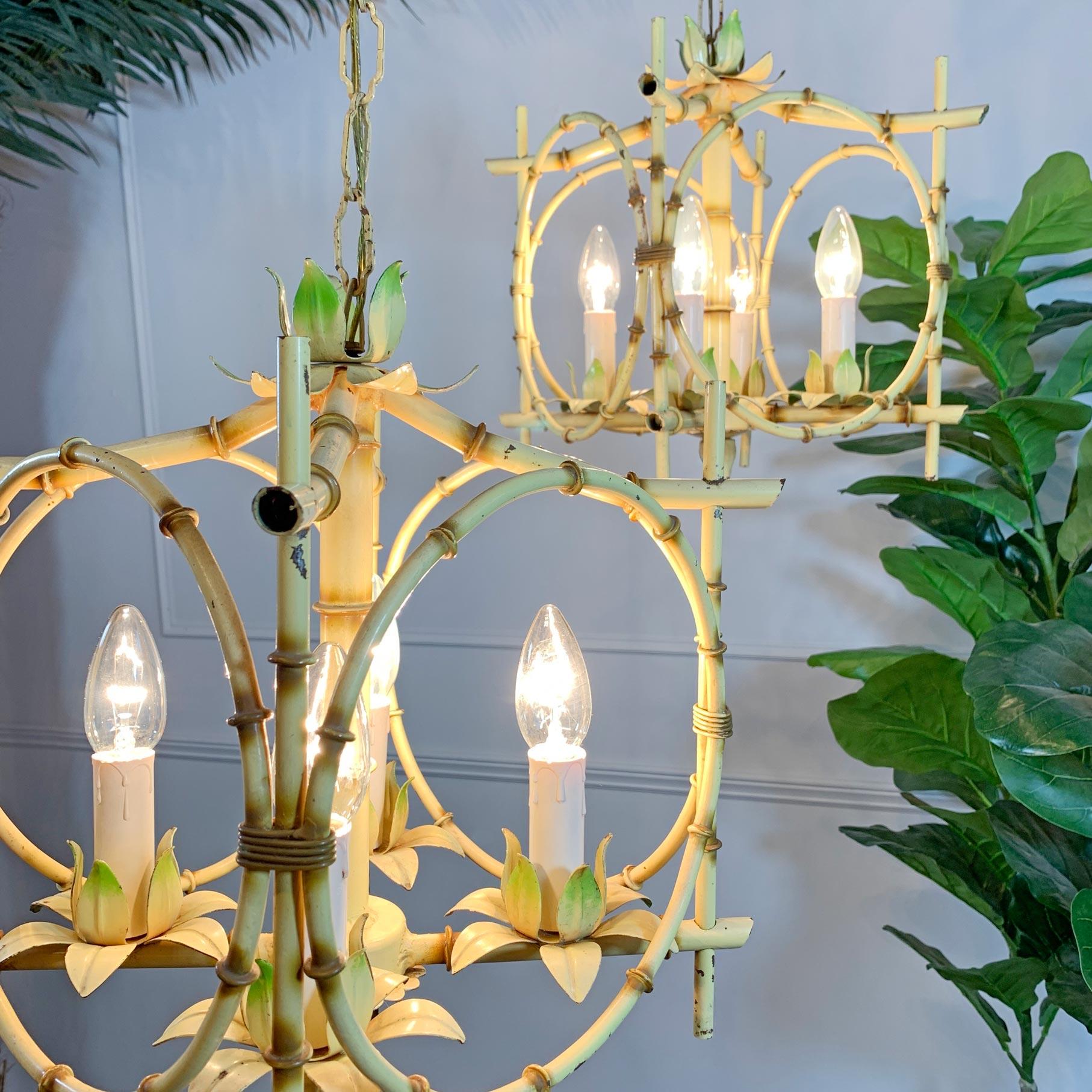 A very rare to find pair of Italian painted faux bamboo pagoda chandeliers. Each in the original, naturally toned paint.

Dating to the 1950's.

Each chandelier houses four e14 lampholders, and both with original chain and matching scalloped ceiling