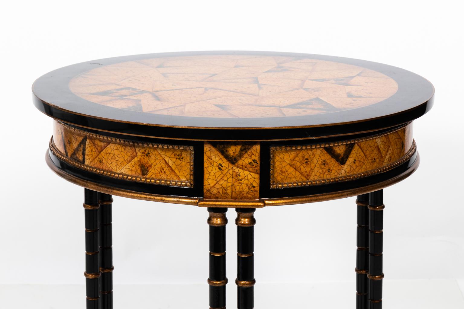 Faux bamboo painted side tables with decorated tops, beaded trim, and bottom shelves, circa 20th century. Please note of wear consistent with age including wear to the tabletop.
 