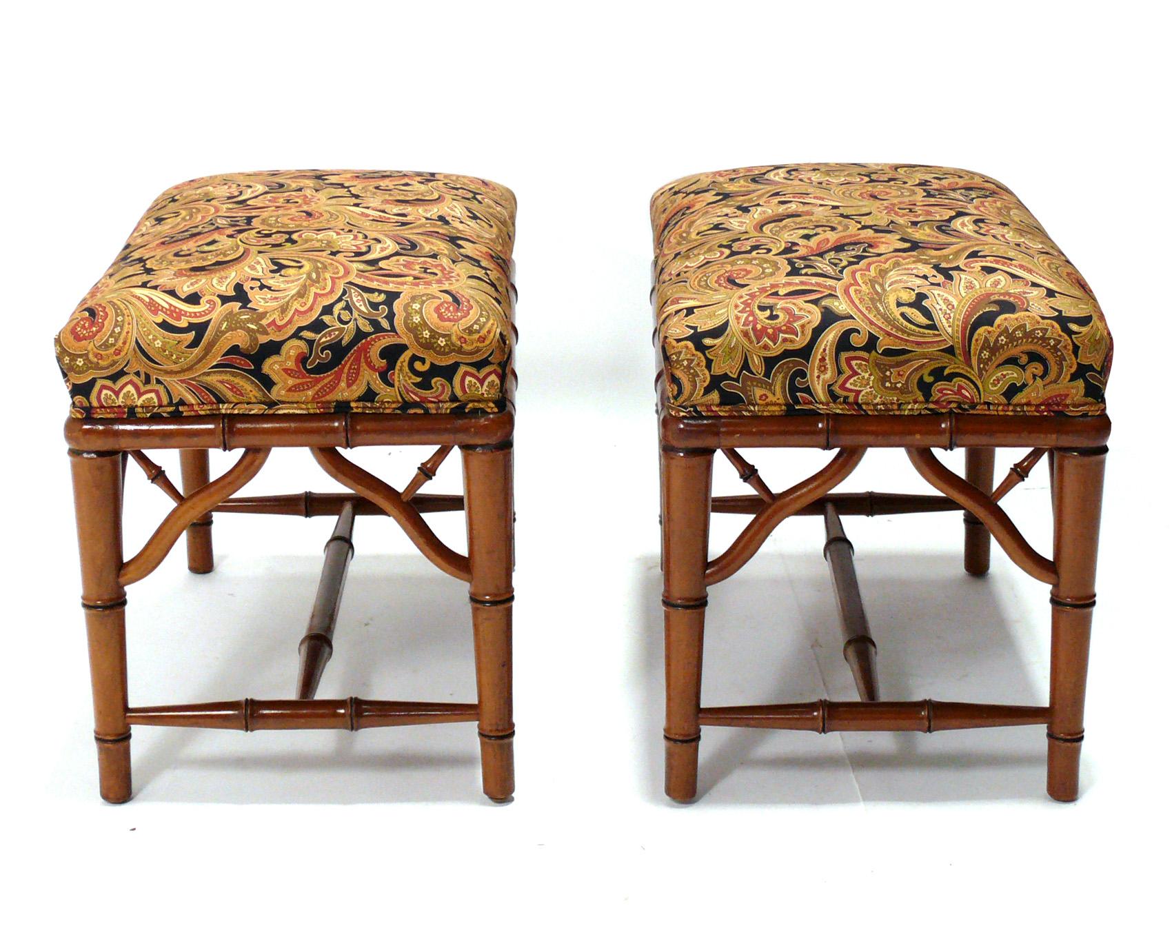 Pair of Faux bamboo wood stools or benches, American, circa 1960s. These pair of stools are currently being reupholstered and can be completed in your fabric. Simply send 1.5 yards of your fabric after purchase. The price noted includes reupholstery