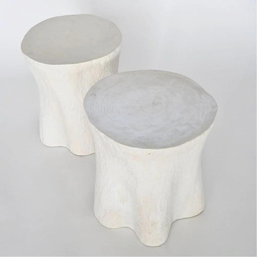 Lovely pair of off white faux bois side tables in painted cast resin. Unique and organic shape with delicate texture. Mid to late 20th century. Beautiful vintage condition with minor wear consistent with age and use

