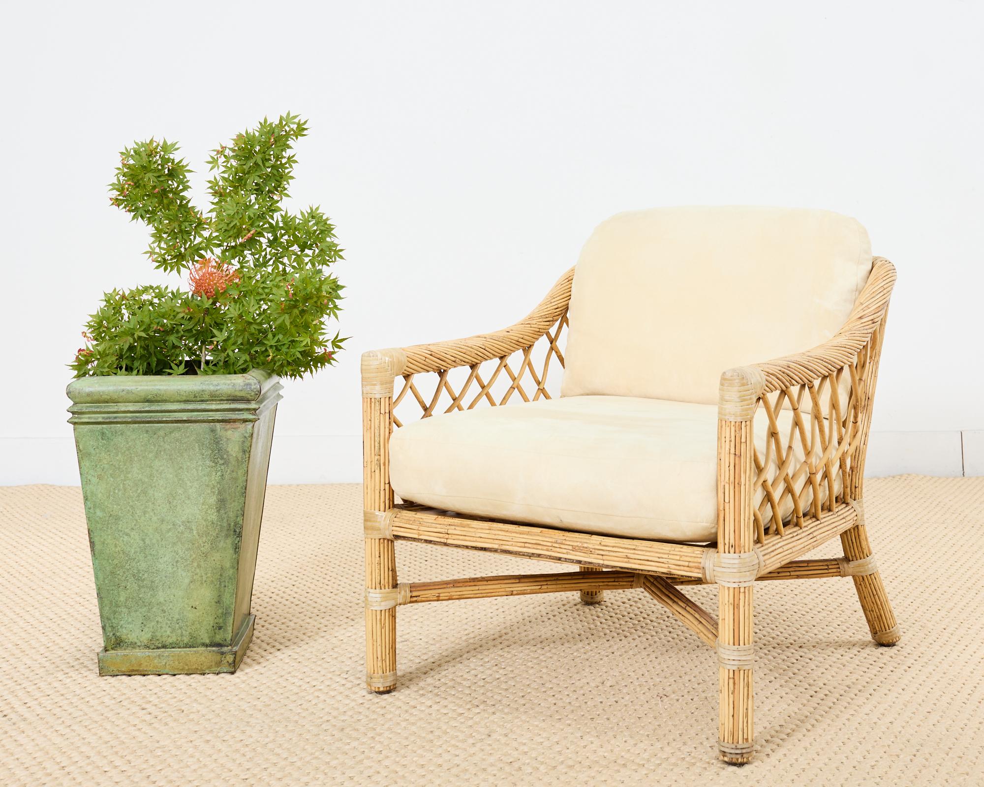 Distinctive pair of patio and garden planters or jardinaires crafted from metal featuring a faux bronze aged finish. The planters have been faux-painted to appear like aged bronze with a heavily patinated verdigris finish. The square planters have