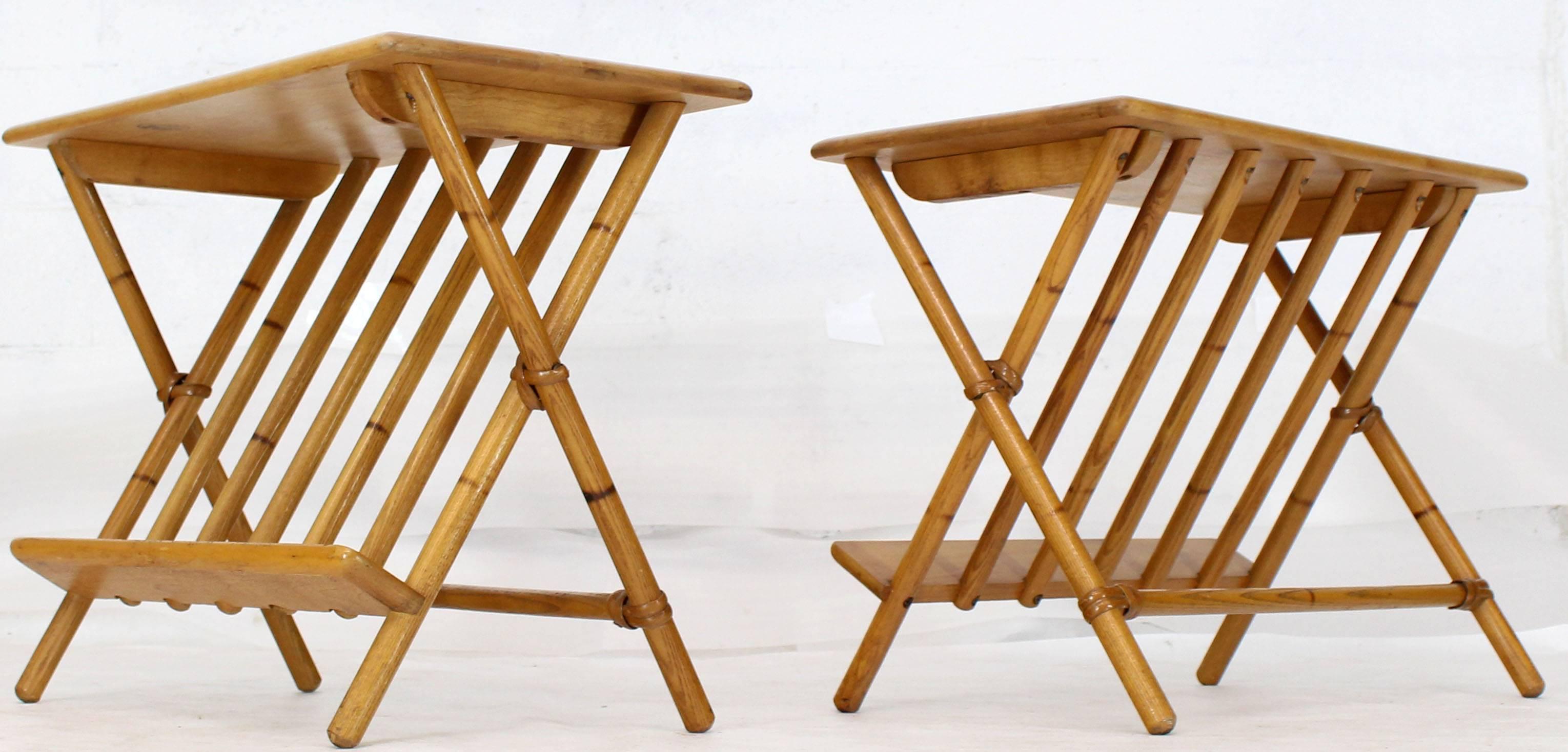 Pair of blond birch Mid-Century Modern X-base end side tables with magazine rack.