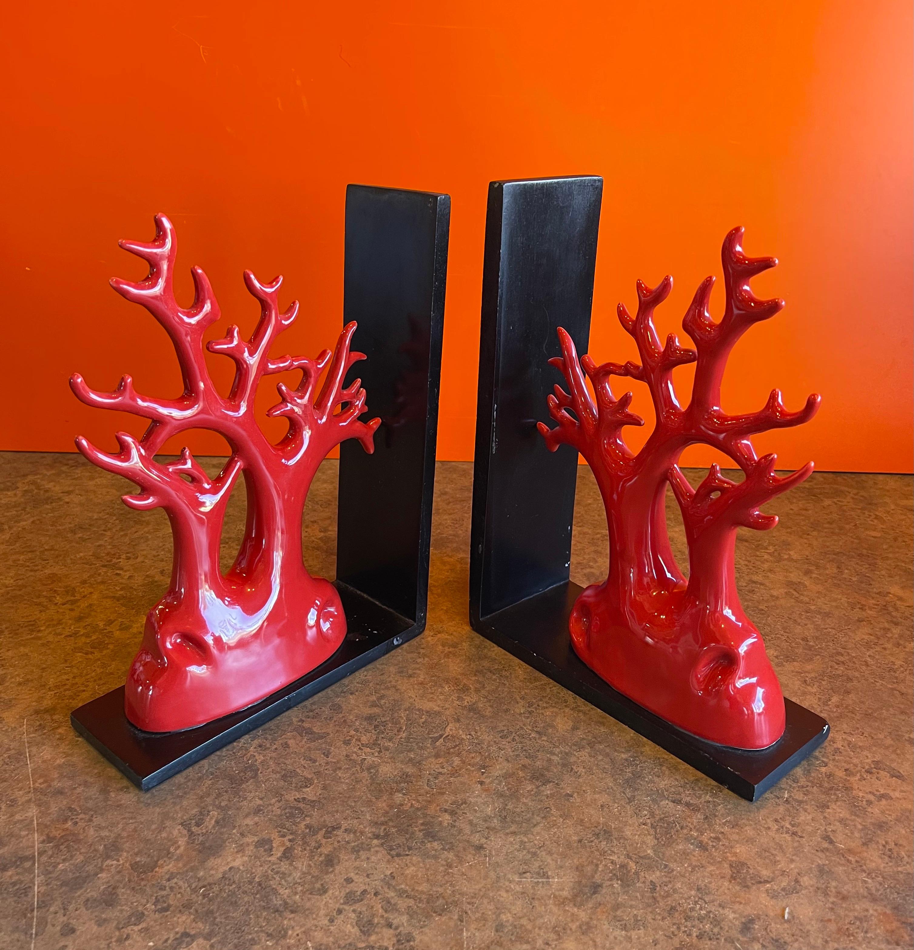 Beautiful pair of faux coral ceramic bookends, circa 1990s. This elegant and unique pair are in good vintage condition and measure 16