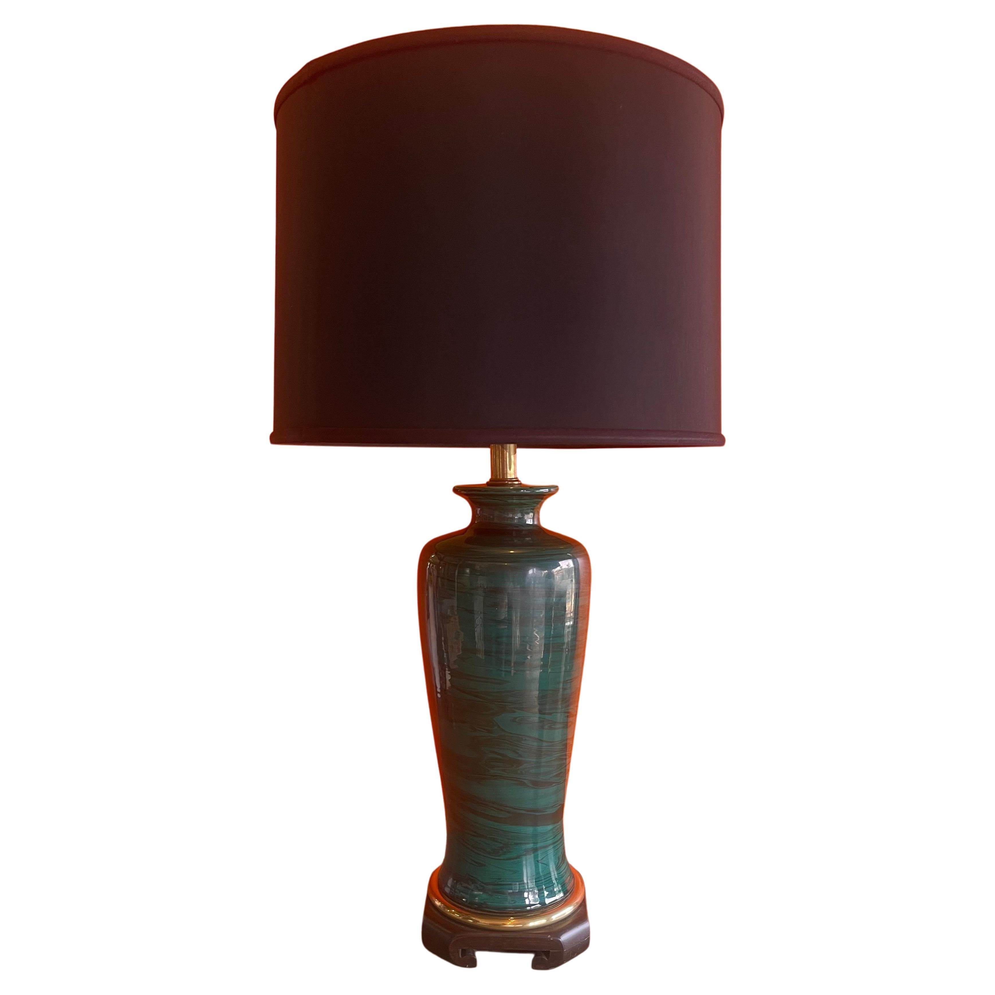 Gorgeous pair of faux malachite table lamps with black silk drum shades by Frederick Cooper Lamp Co. of Chicago, circa 1970s. With a definite Asian aesthetic, lamp features a wavy teal and green porcelain shaped ginger jar vessel with a beautiful