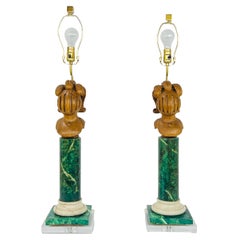 Coppia di lampade in legno finto marmo su basi in lucite
