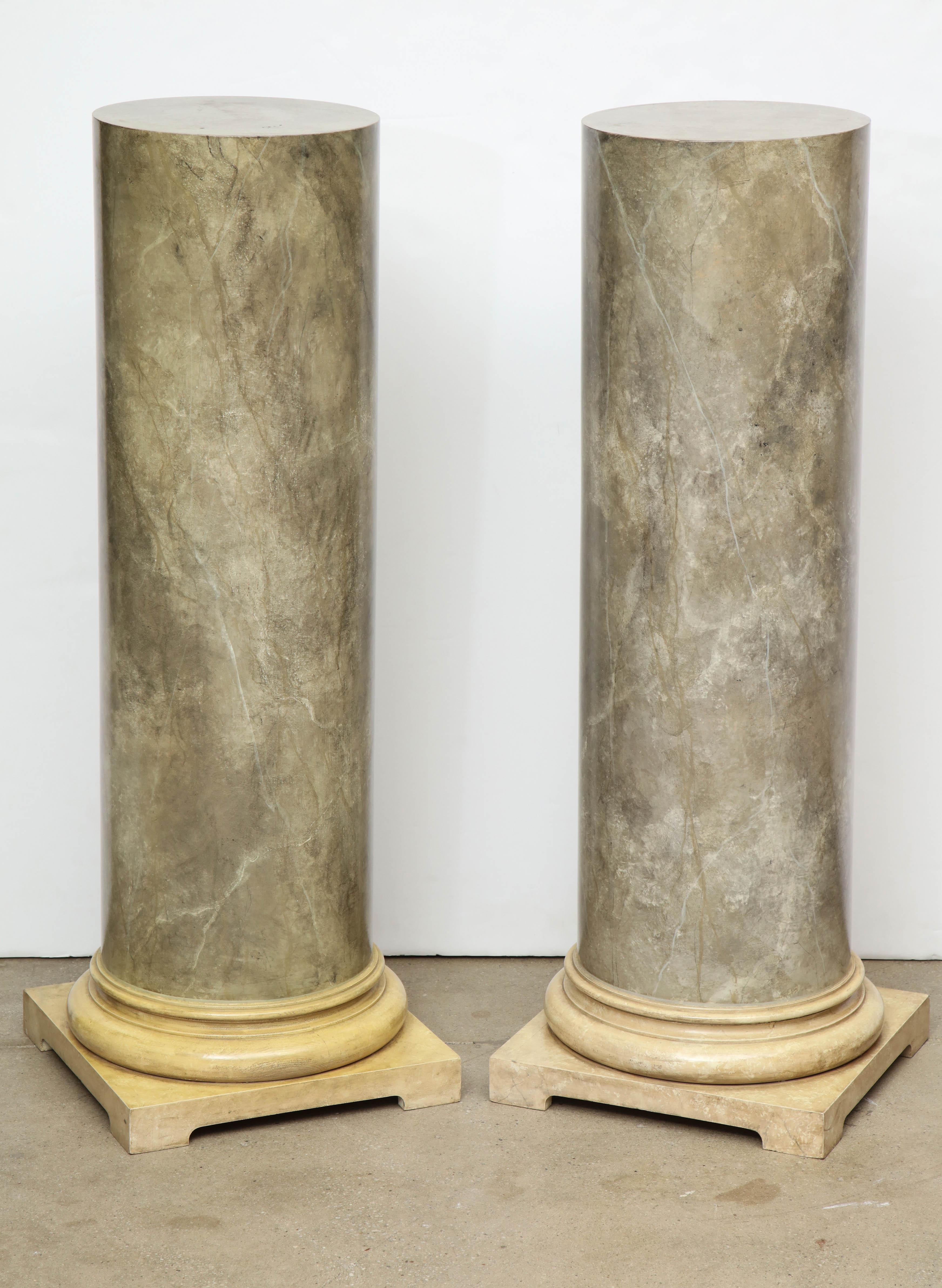 These Classic column pedestals have a faux marble finish in a gray/green color on a cream color base. Perfect pieces to display a sculpture or plant, or to add architectural interest to a space.