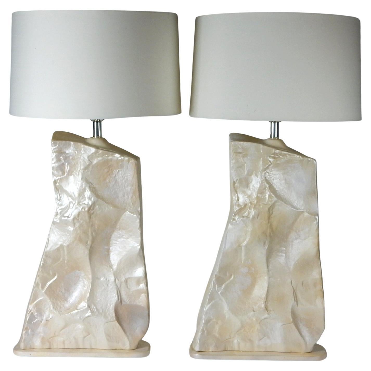 Very large realistic faux slate stone table lamps.
Made of a ceramic plaster material covered in pearl enamel.
Footed bases are wood, painted same color. Chrome plated hardware. Circa 1970's.
Possible European design with import markings on