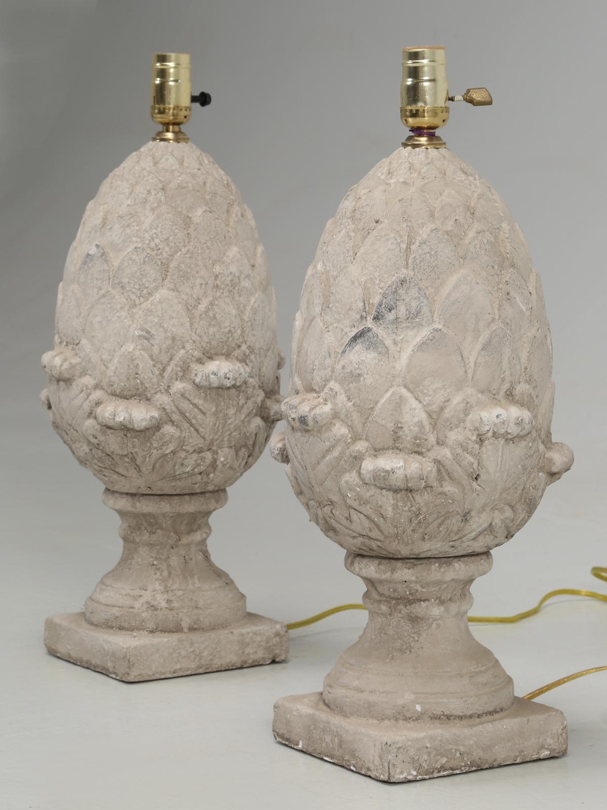 Pair of lamps done in a faux stone appearance, in the shape of an artichoke. Our in-house electrical department, has converted the pair of lamps to USA standards.
Height was measured at the top of the socket.