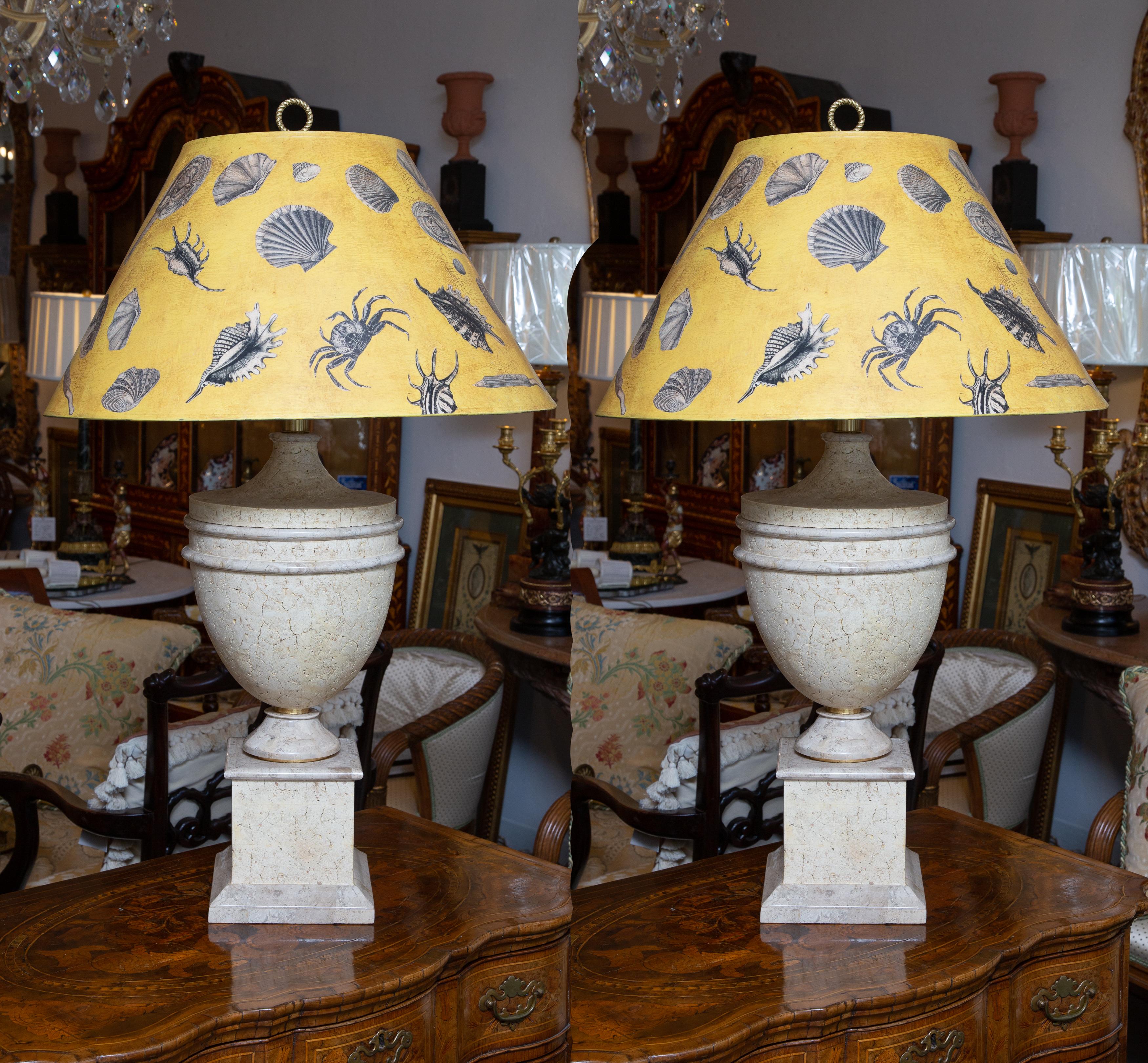 This is a very elegant pair of faux stone urn form table lamps with decorative hand-made custom shades, 20th century.