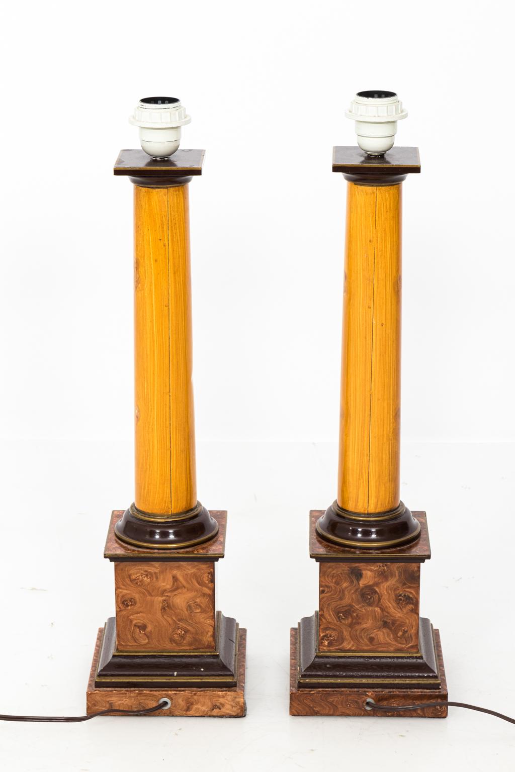 Pair of tole table lamps in a painted faux wood finish, circa 1990s.