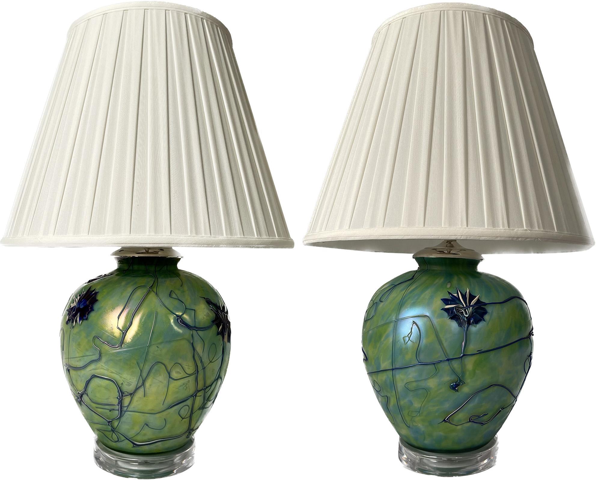 A pair of enamel decorated favorite glass lamps on lucite bases.

Dimensions: 24